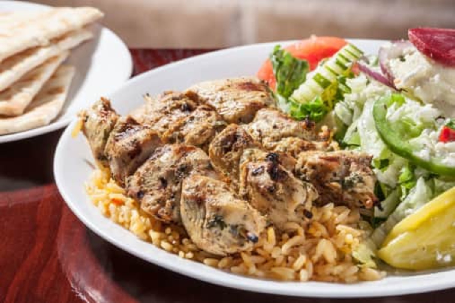 Order Chicken Skewers with Rice & Greek Salad Dinner food online from Little Greek Fresh Grill store, Youngstown on bringmethat.com