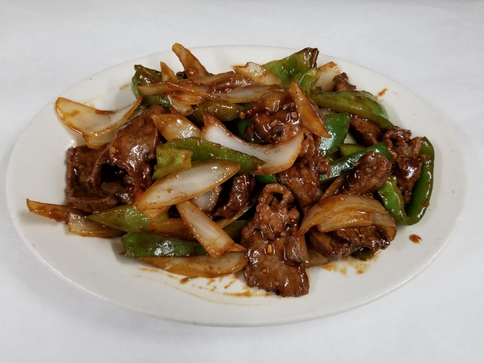 Order 88. Pepper Steak with Onions food online from Kaieteur Restaurant store, Richmond Hill on bringmethat.com