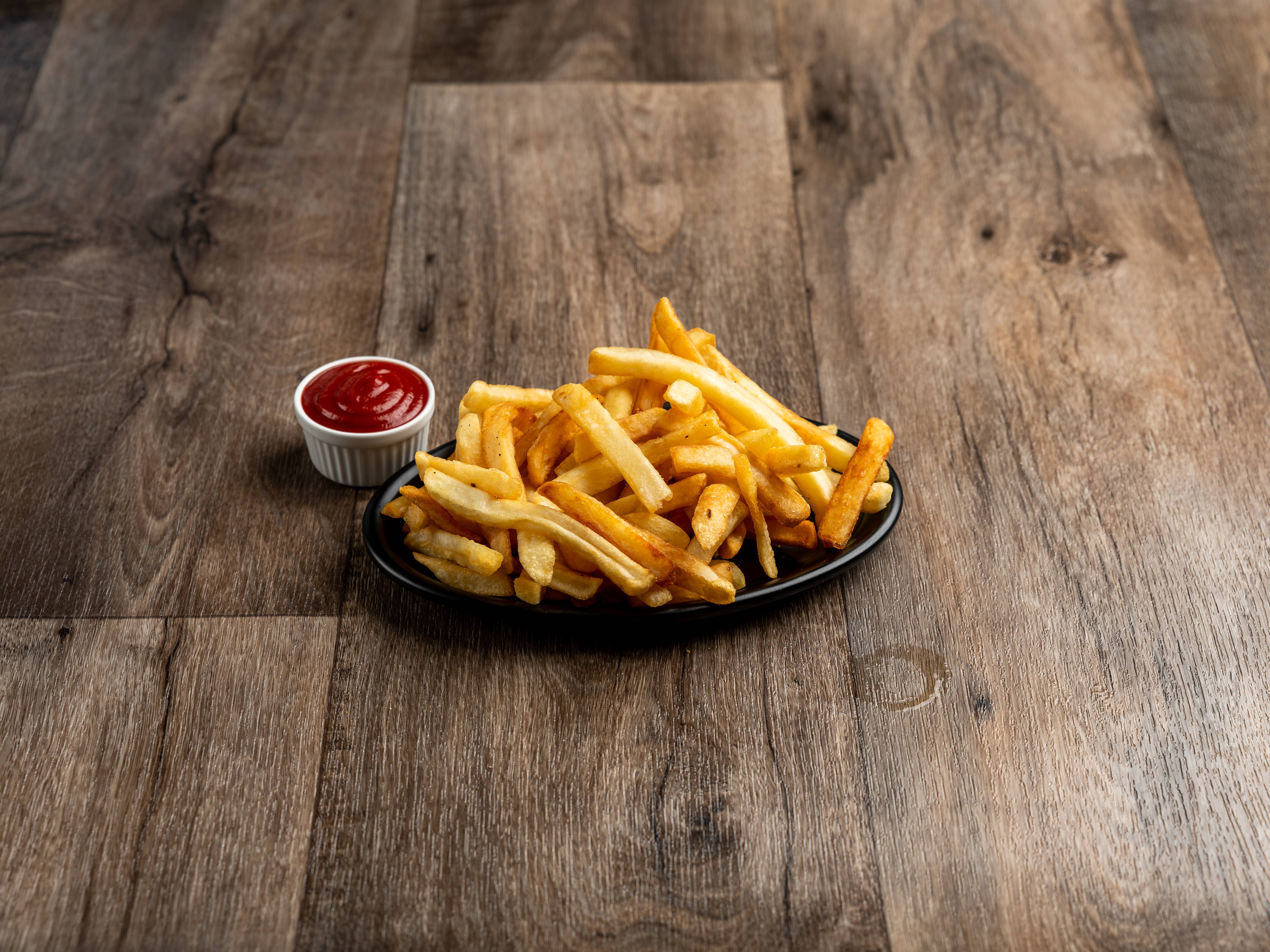Order French Fries food online from Universal Pizza & Subs store, Baltimore on bringmethat.com