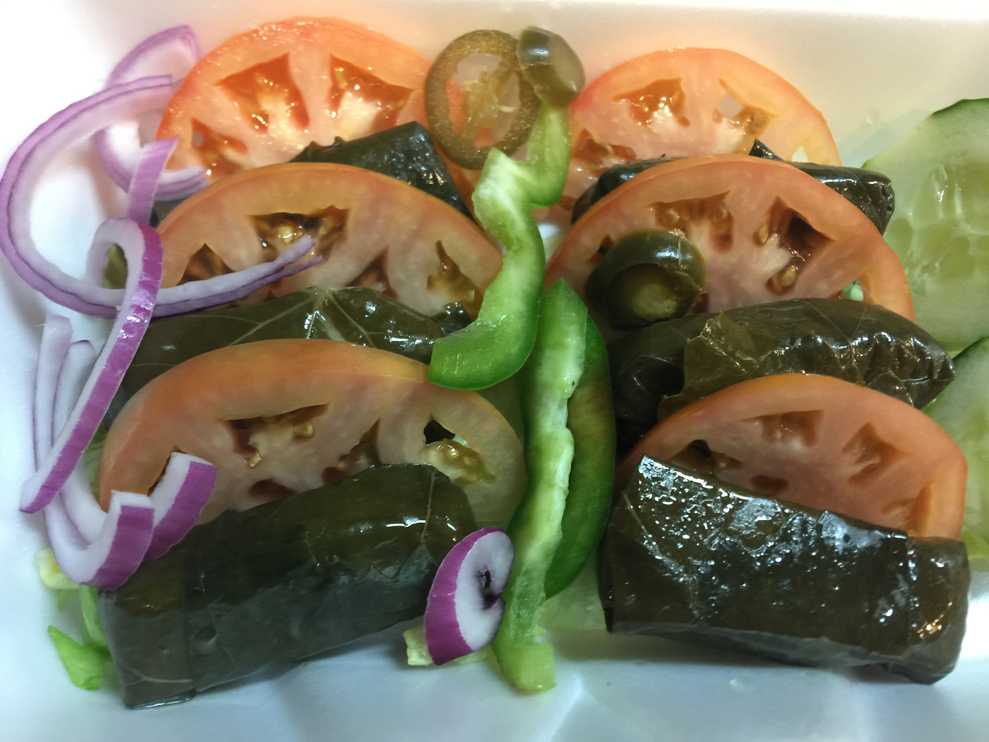Order 6 Pieces Stuffed Grape Leaves food online from Husky Pizza store, Coventry on bringmethat.com