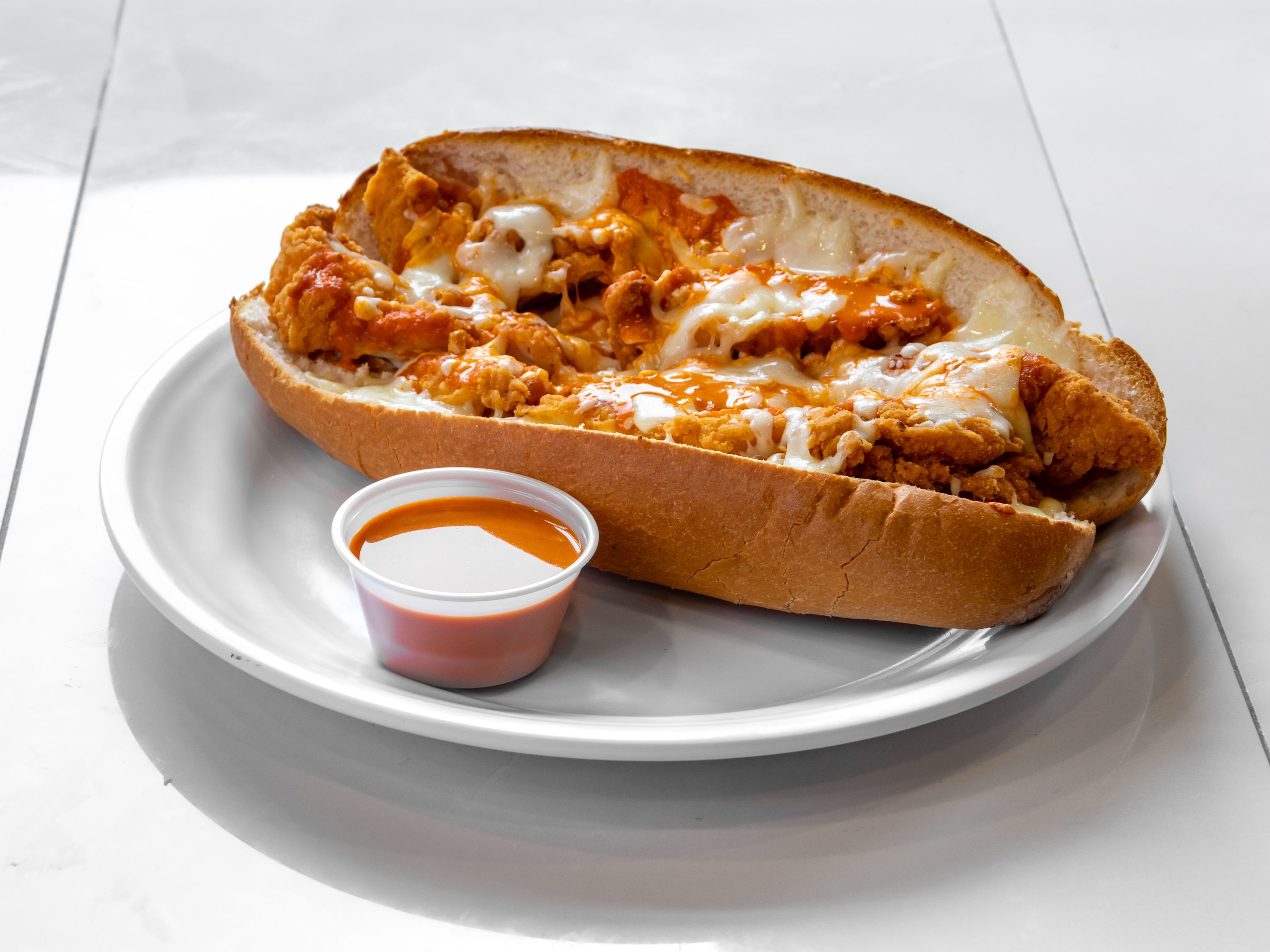 Order Hot Buffalo Chicken Sub food online from New Yorker Pizza store, Leesburg on bringmethat.com