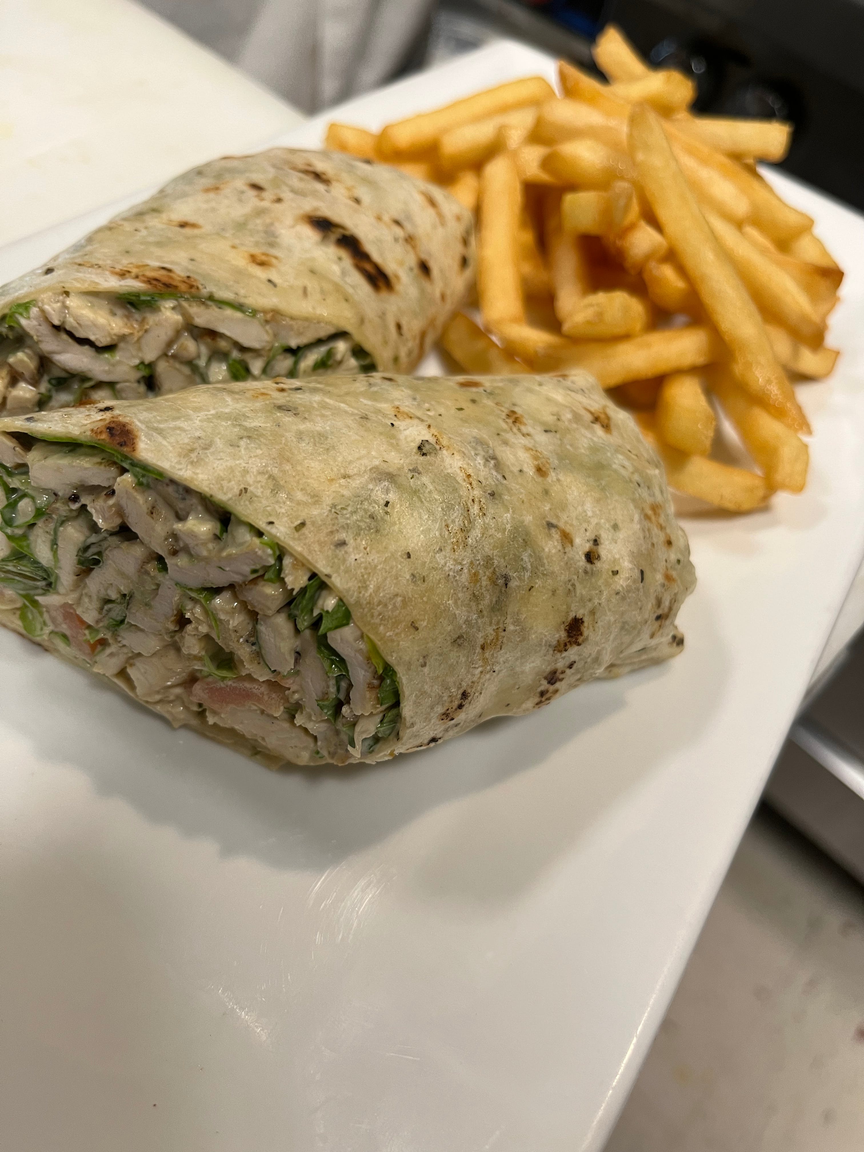 Order Caesar Chicken Wrap - Wraps food online from Angelina Fine Foods store, Cold Spring on bringmethat.com
