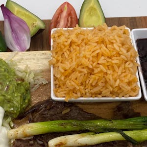 Order Rice (8 oz) food online from El Caballo Wraps store, Alameda on bringmethat.com