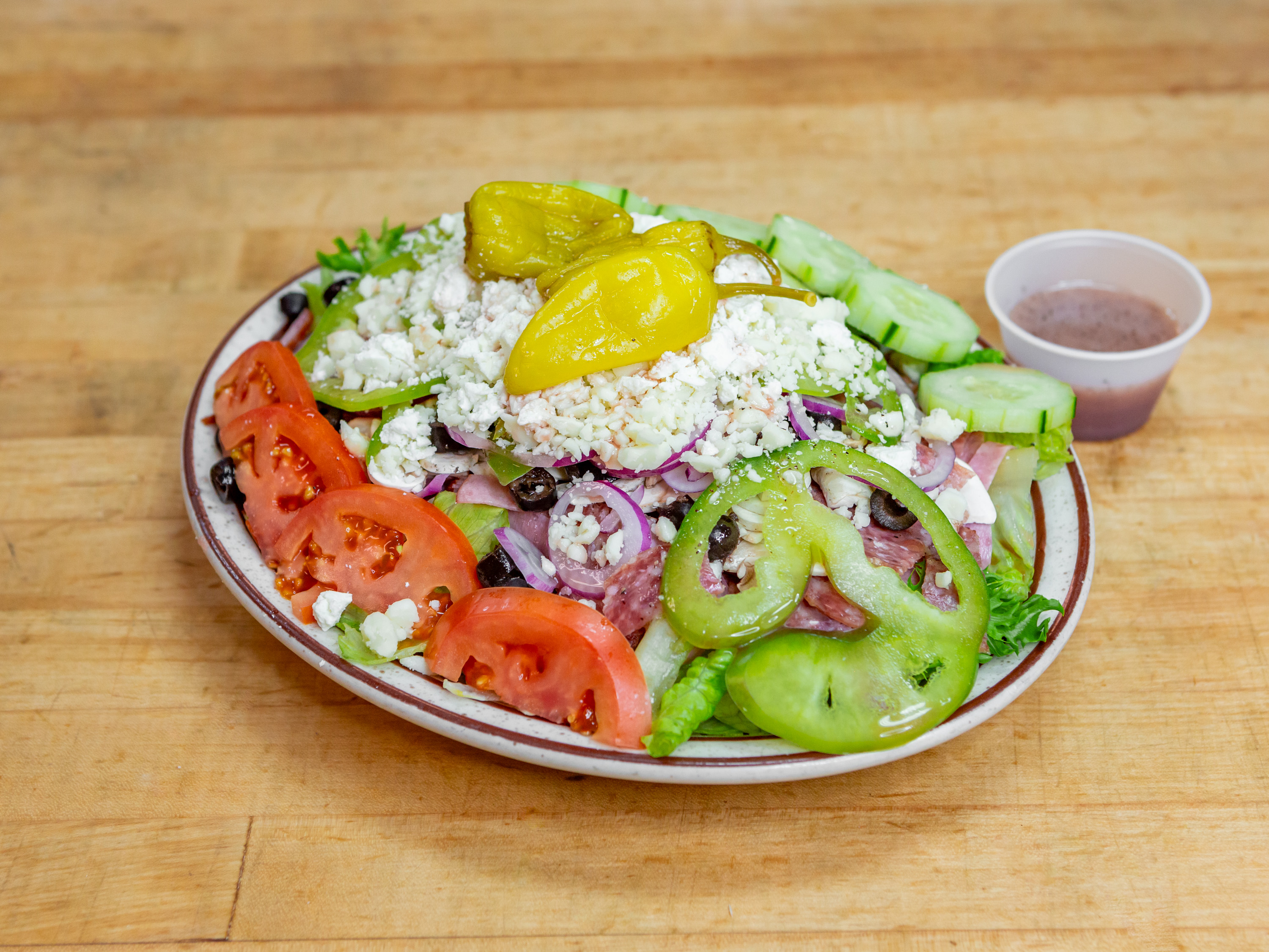 Order Greek Salad with Garlic Bread food online from Guidos Pizza store, Anchorage on bringmethat.com