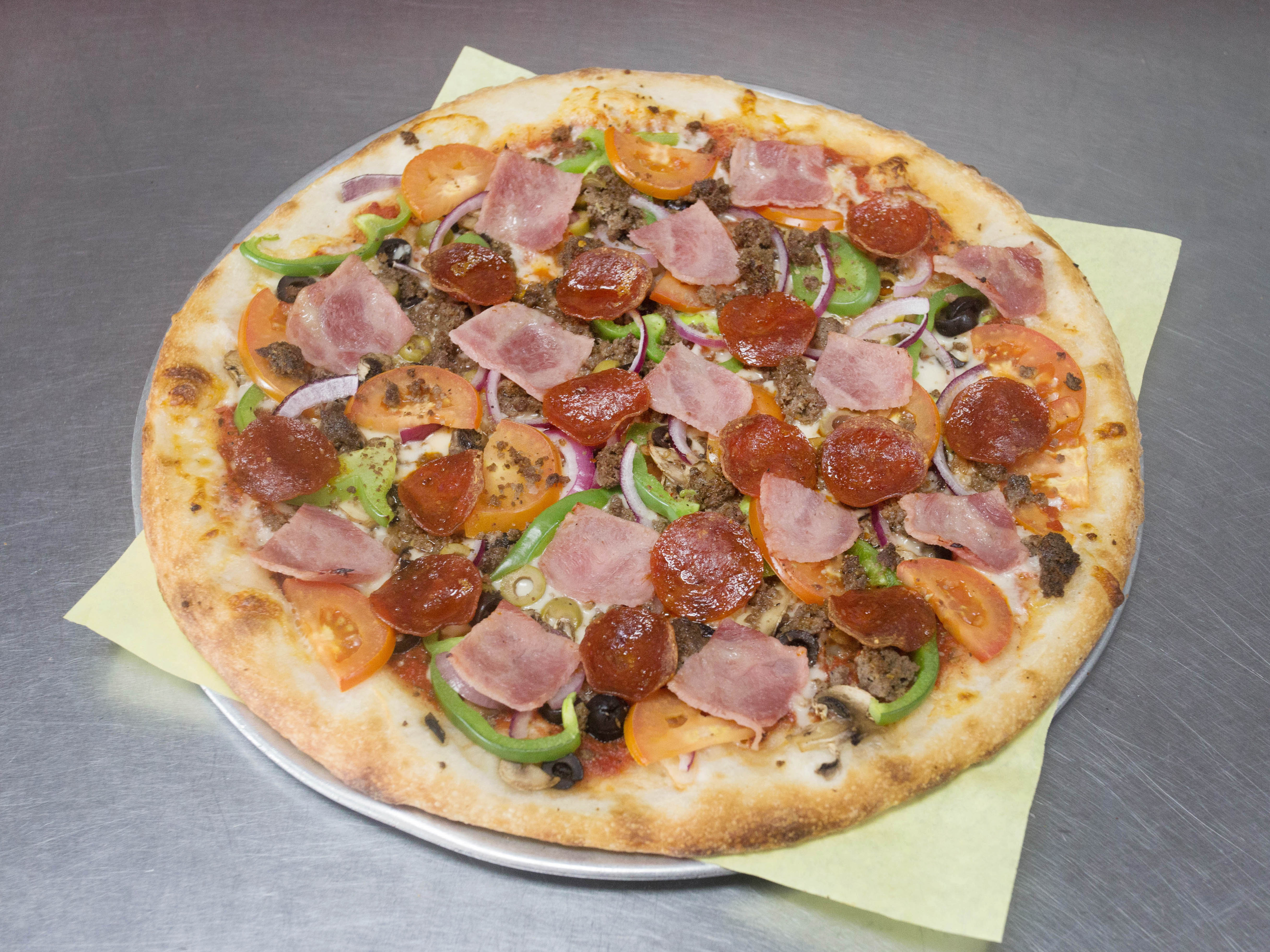 Order The Works Pizza food online from Yaghi Pizzeria store, San Antonio on bringmethat.com