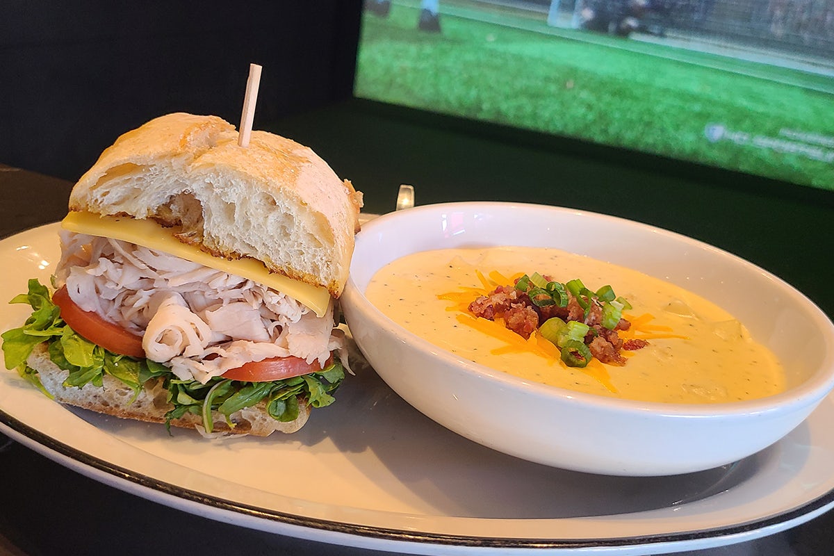 Order HALF SANDWICH & SOUP COMBO  food online from 54th Street Grill & Bar store, Glen Carbon on bringmethat.com