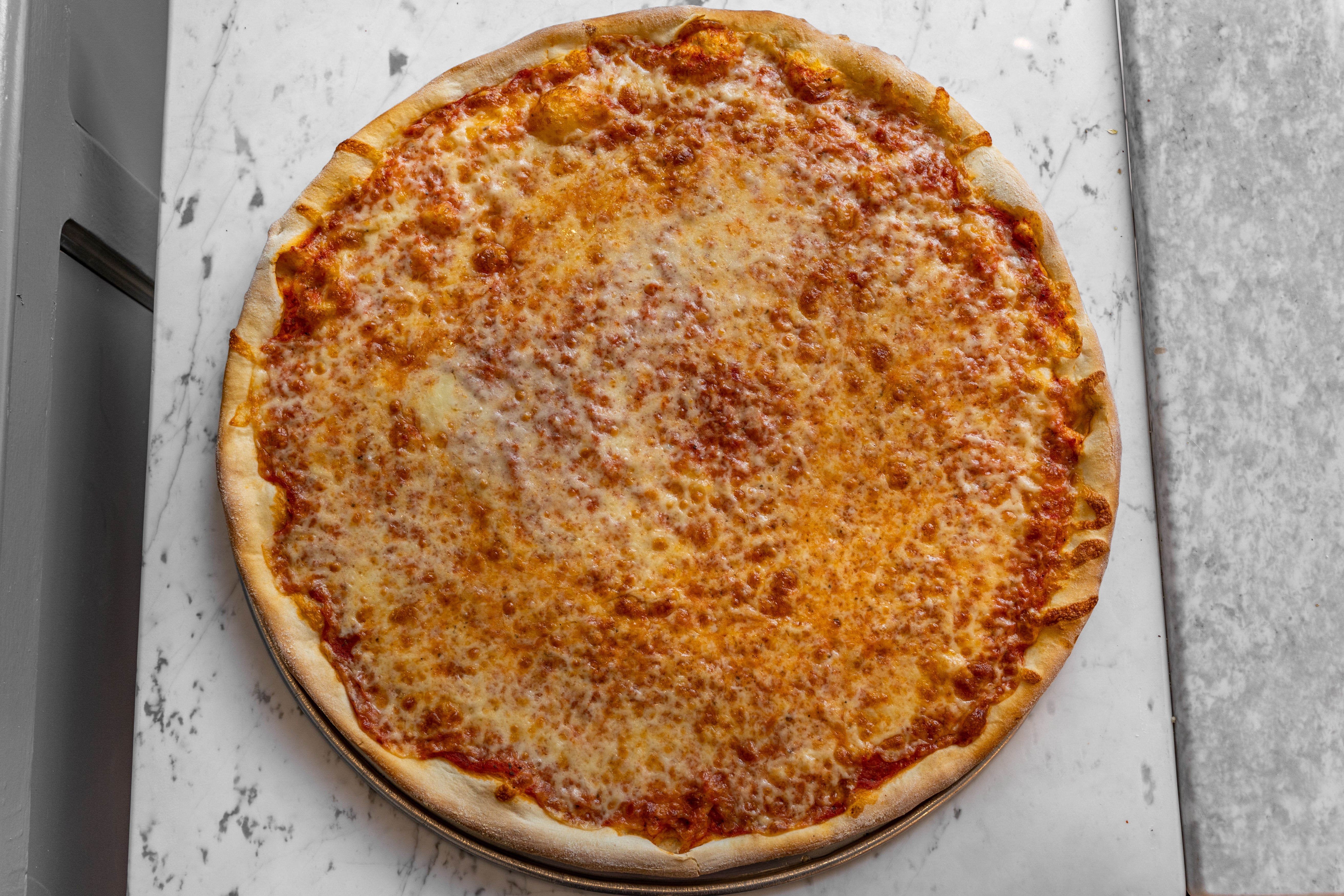 Order Regular Cheese Pizza - Personal 12" food online from Roma's pizza store, New York on bringmethat.com