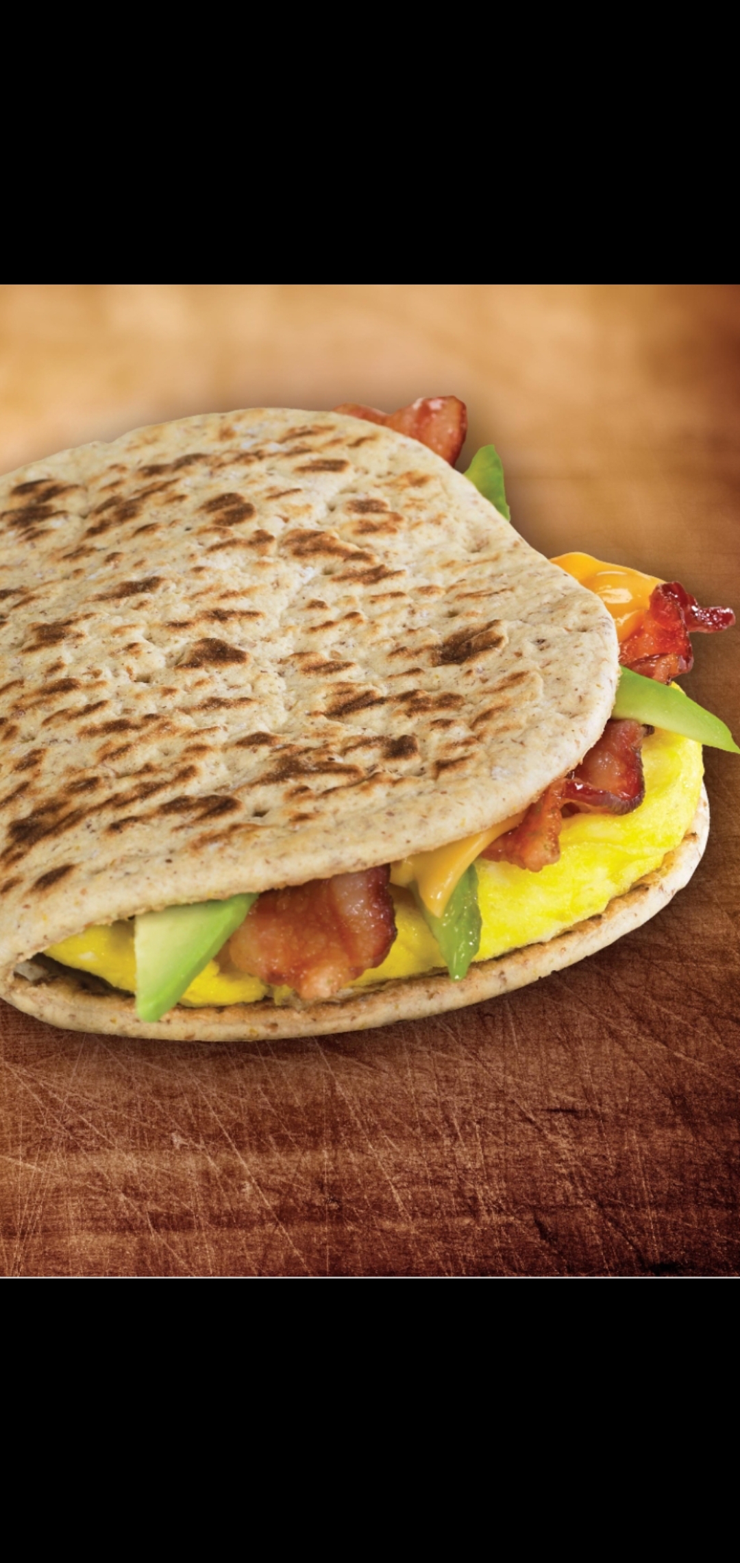 Order Bacon Eggs & Cheese With Half Avocado Panini Breakfast Sandwich  food online from American Gourmet Foods Deli store, New York on bringmethat.com