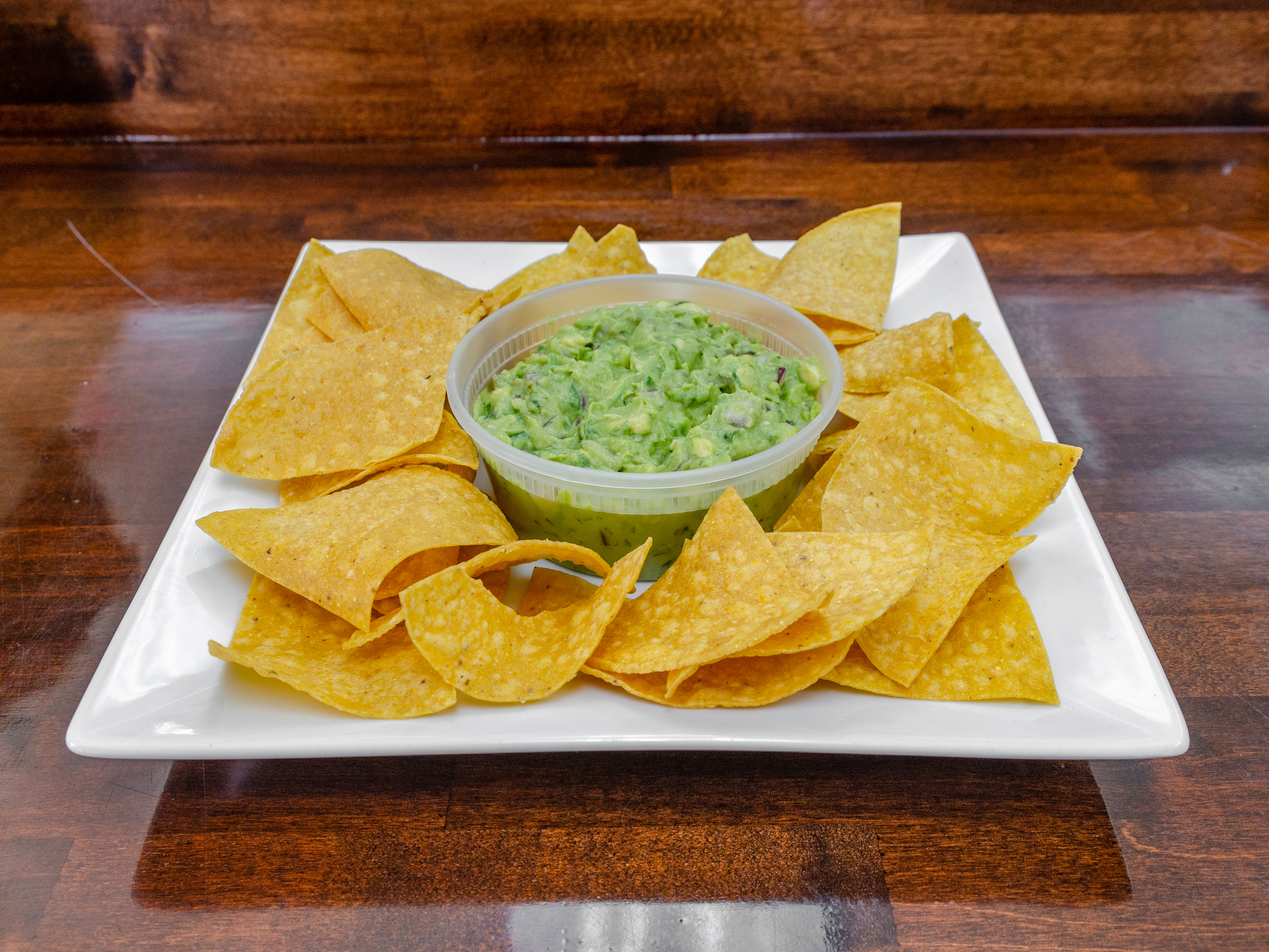 Order 8oz. Guacamole and Chips food online from Avila Taqueria & Restaurant store, West New York on bringmethat.com