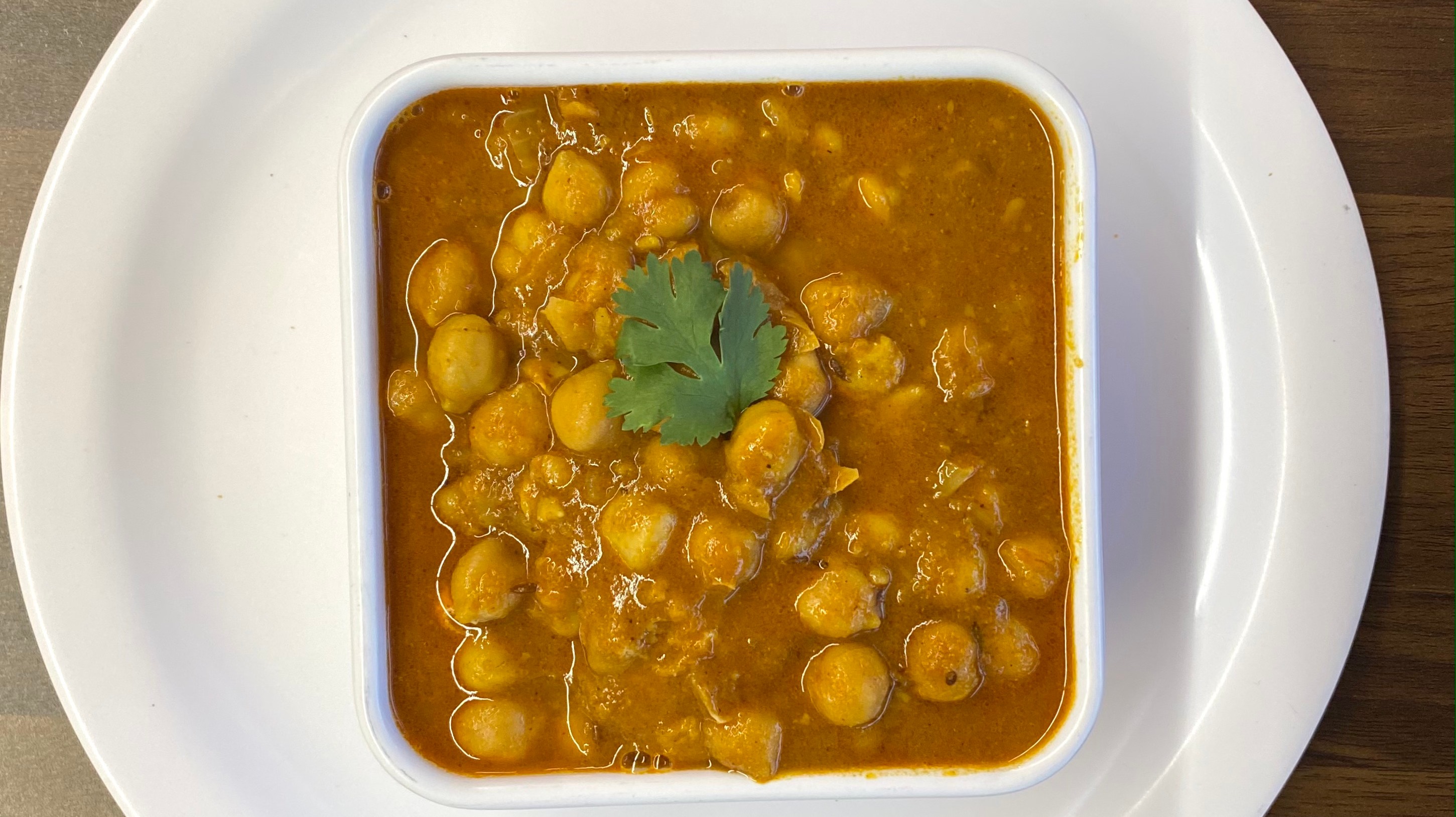 Order Chana Masala food online from Indian Cafe store, East Moline on bringmethat.com