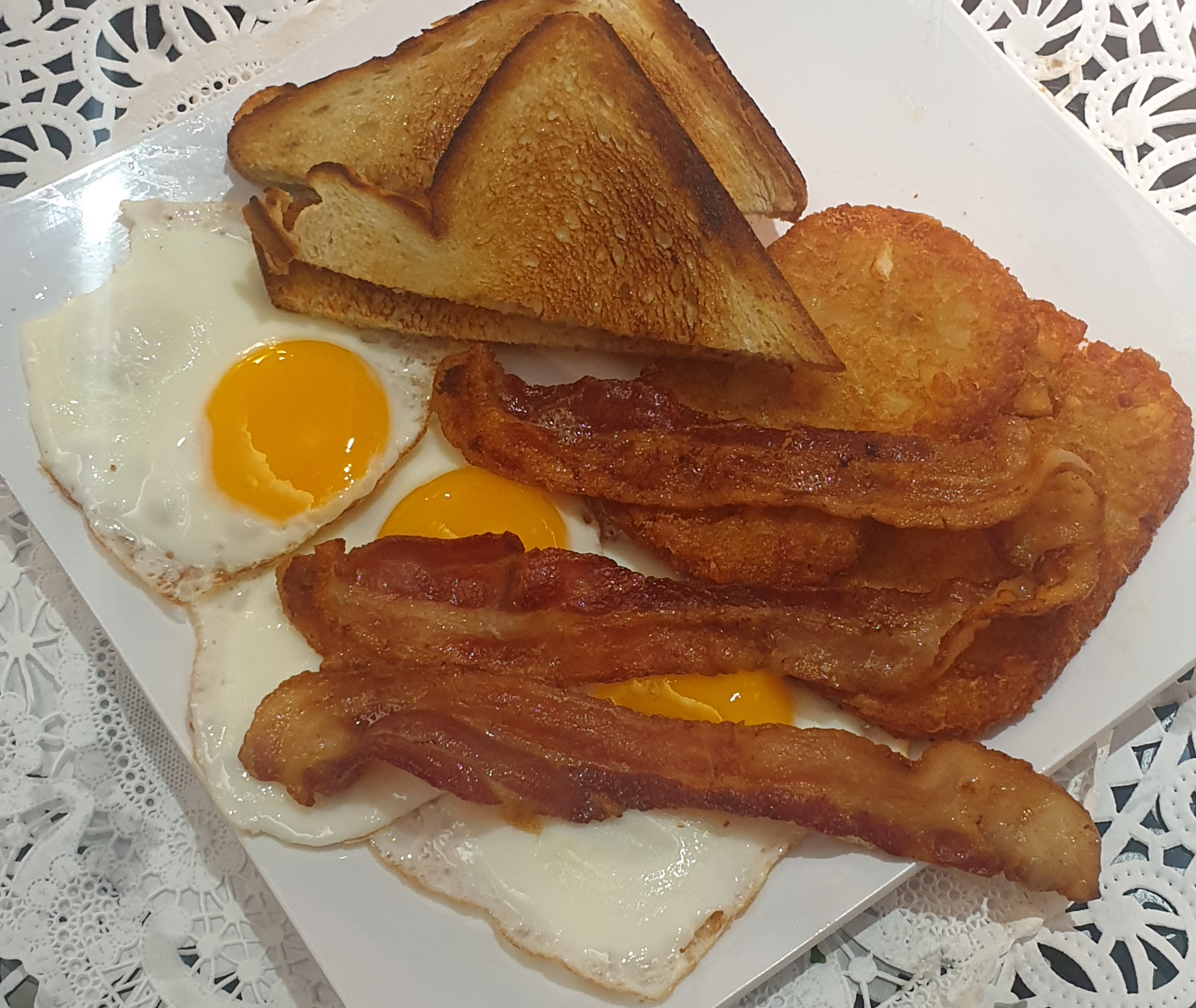 Order 14B-3 Eggs Hashbrown and Buttered Toast food online from Taz Cafe store, New York on bringmethat.com