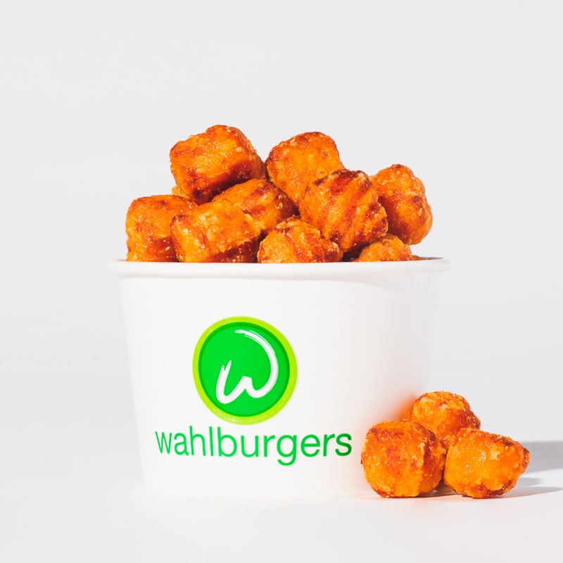 Order SWEET POTATO TOTS food online from Wahlburgers store, Myrtle Beach on bringmethat.com