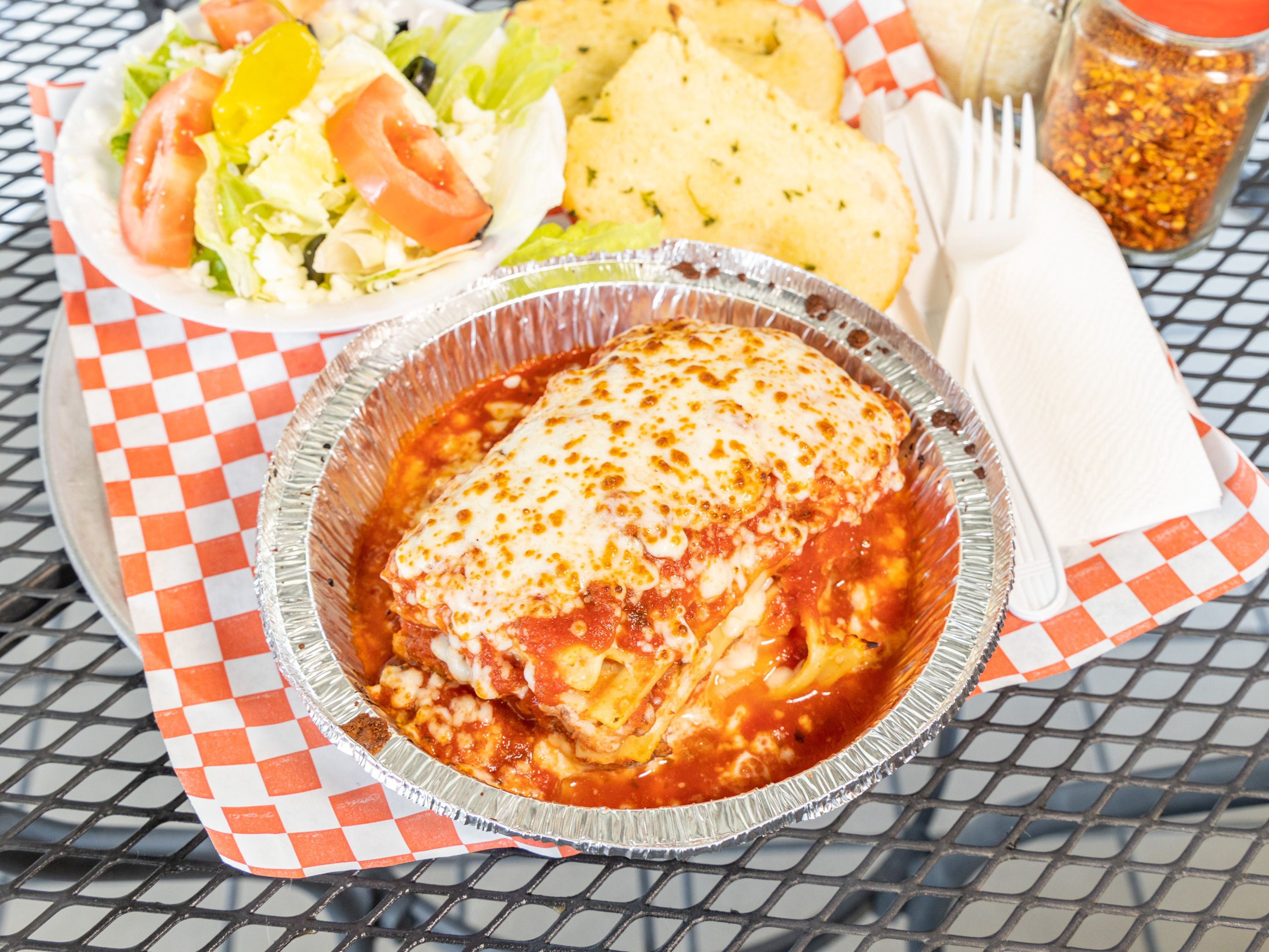 Order Meat Lasagna Dinner food online from Your Pizza Stop store, Menifee on bringmethat.com