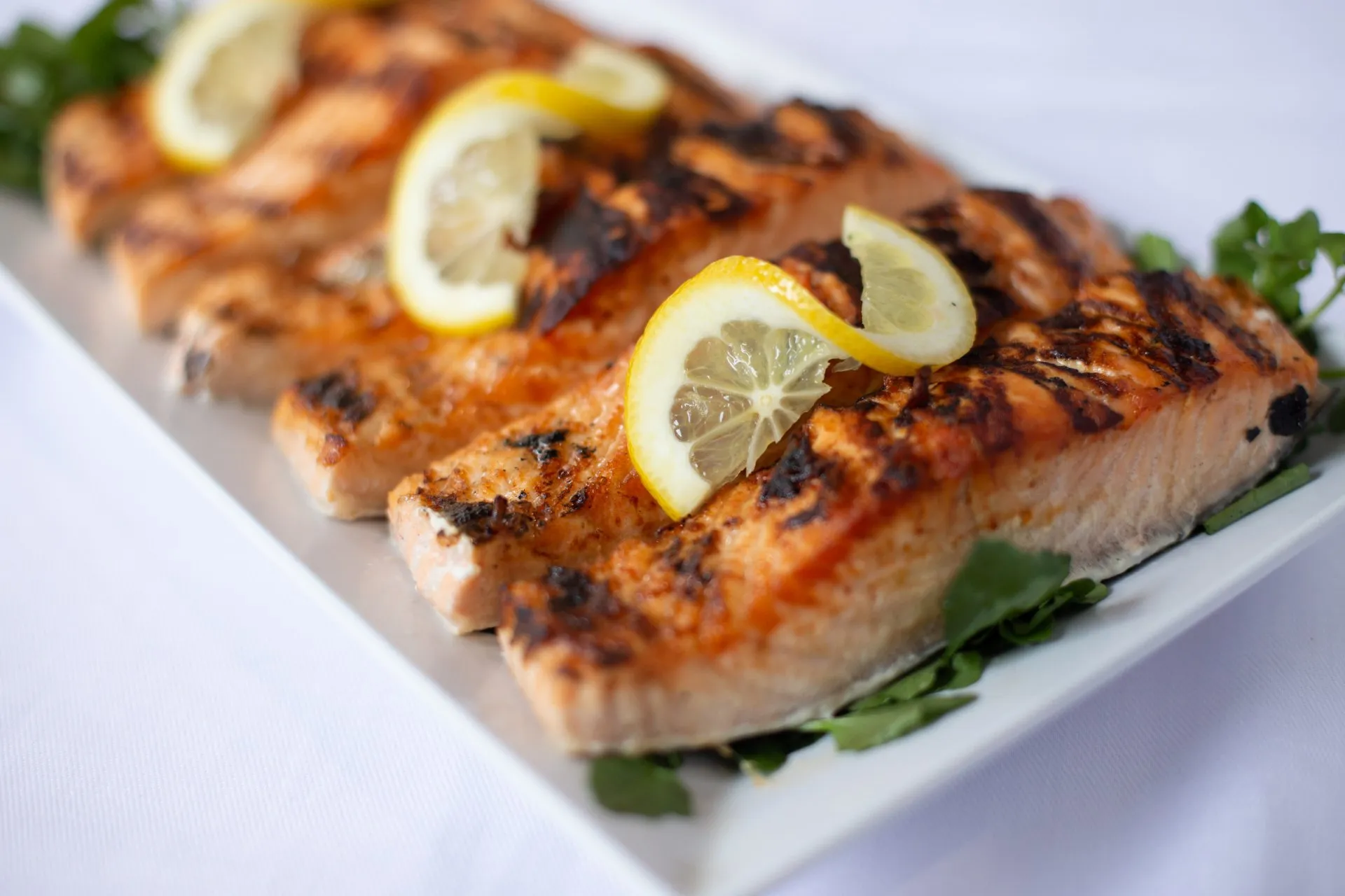 Order 1/2 lb. Grilled Salmon food online from Food Passion Cafe store, New York on bringmethat.com