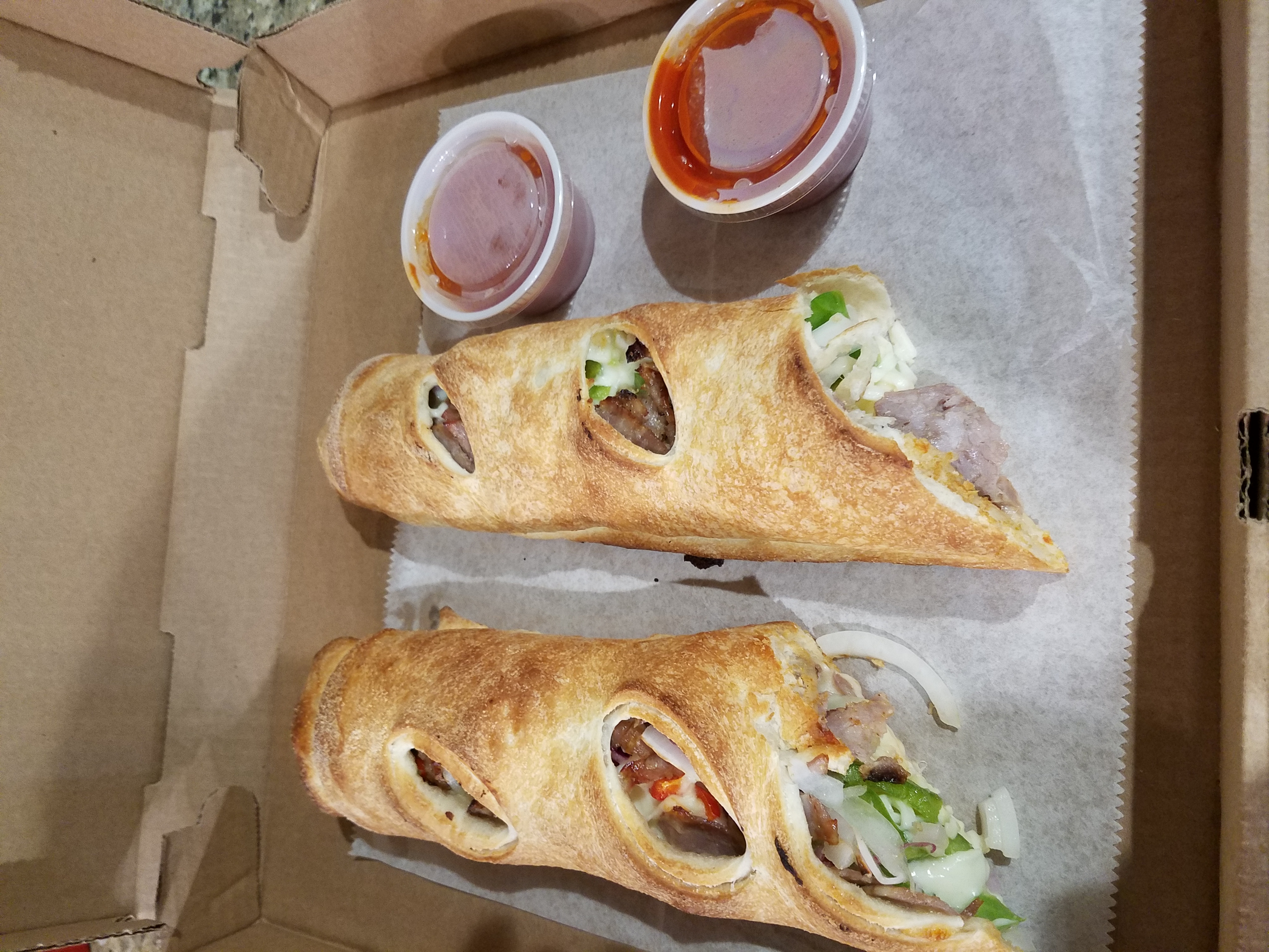 Order Sausage, Peppers, and Onions Stromboli food online from Our Place Pizza & Catering store, Edison on bringmethat.com