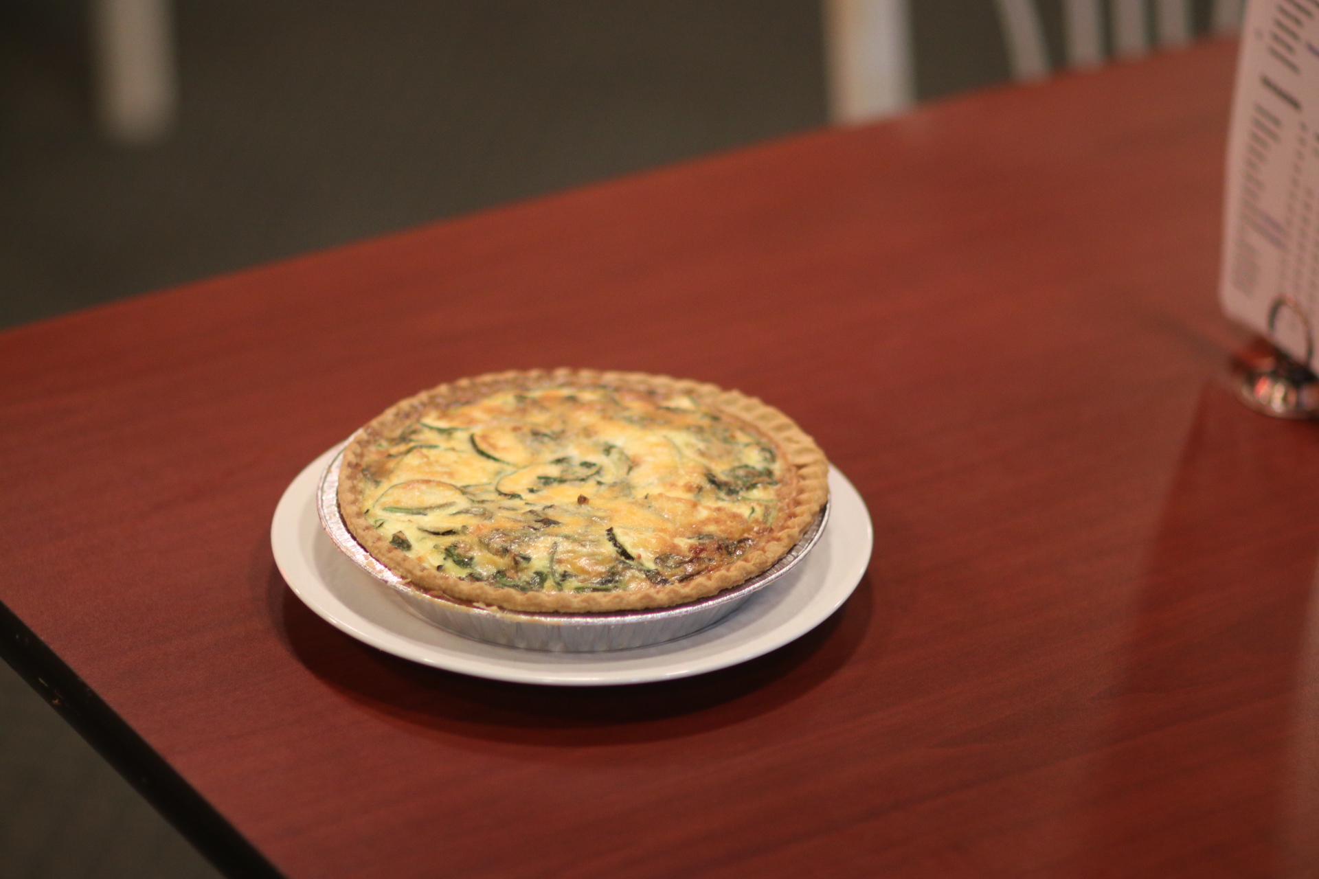 Order Spinach and Zucchini Quiche ( per slice) food online from Tillie's Fine Food & Coffee Company store, Lodi on bringmethat.com