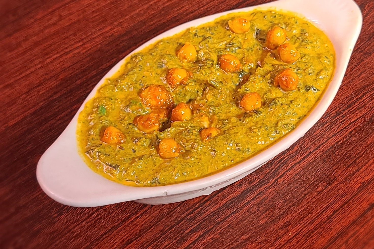 Order Chana Palak food online from Om Indian Cuisine store, San Francisco on bringmethat.com