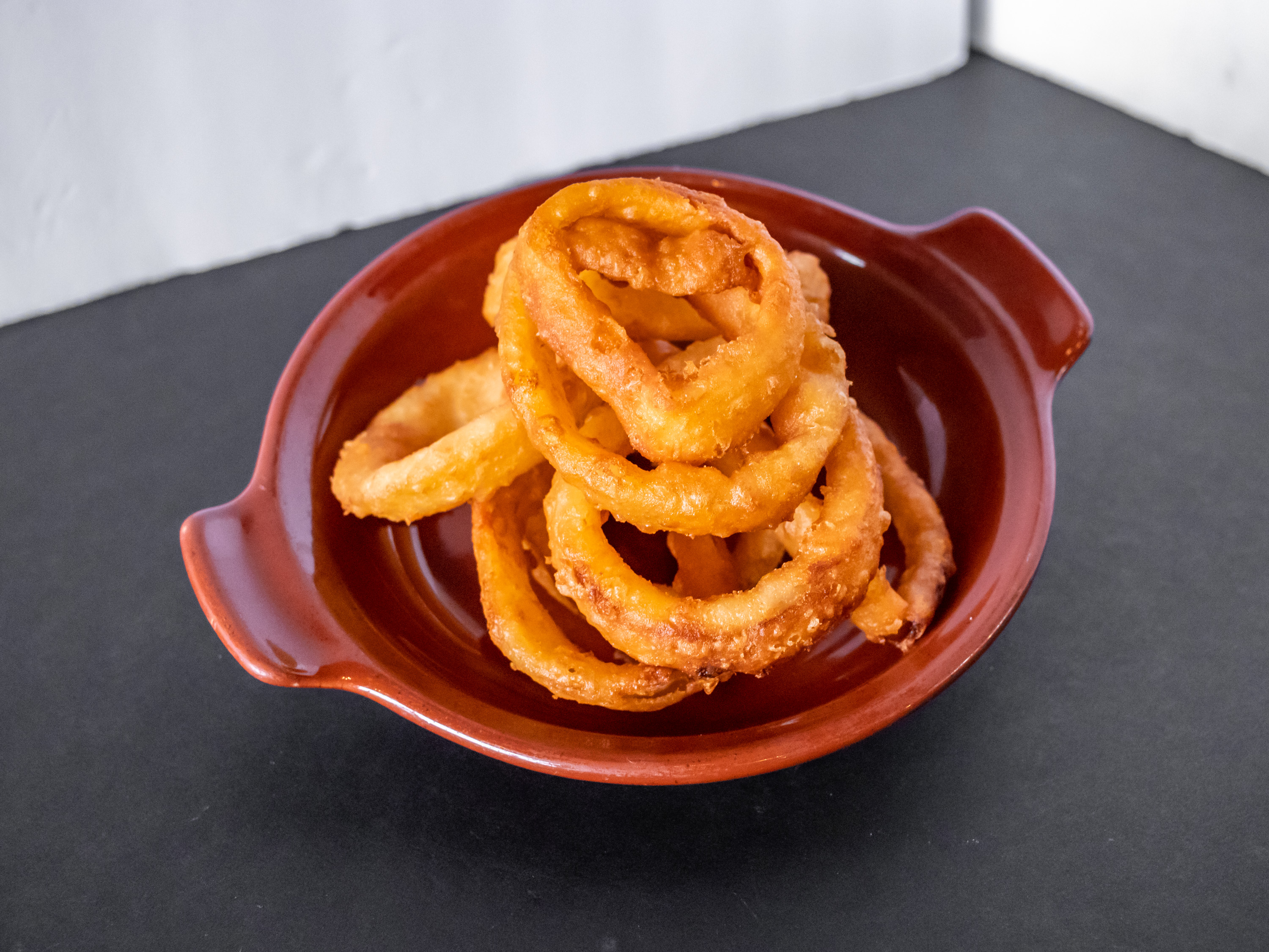 Order Beer Battered Onion Rings food online from STEEL HOUSE BAR & GRILL store, Houston on bringmethat.com