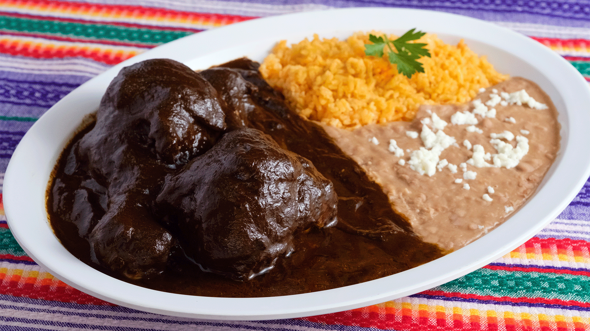 Order Mole Oaxaqueno Combo food online from Tacos Manzano store, North Hollywood on bringmethat.com