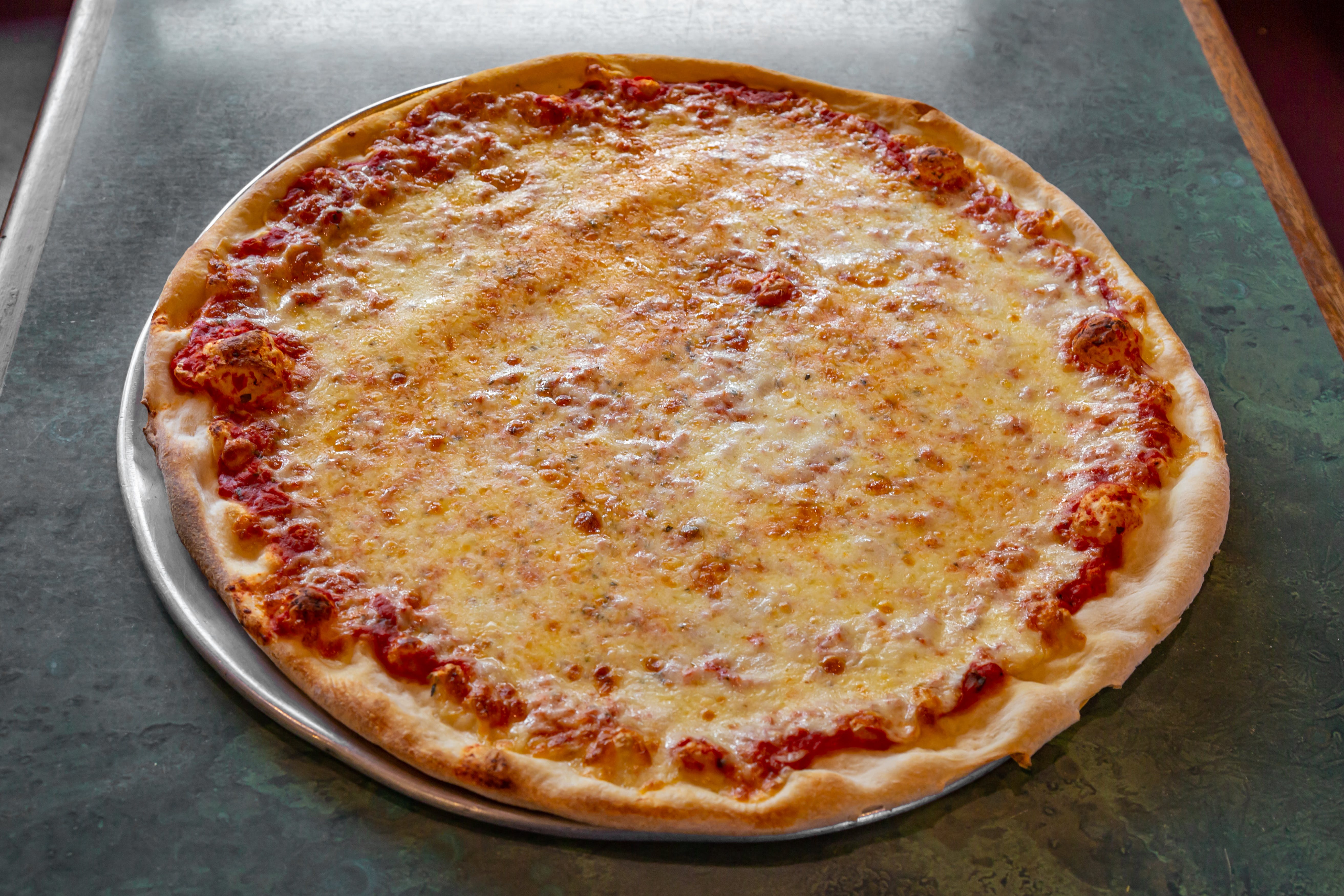 Order Regular Cheese Pizza - 16" food online from Tony's Pizza store, Medford on bringmethat.com