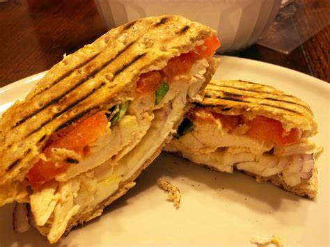 Order 4. Chipotle Panini food online from Cafe Deli-Cious store, New York on bringmethat.com