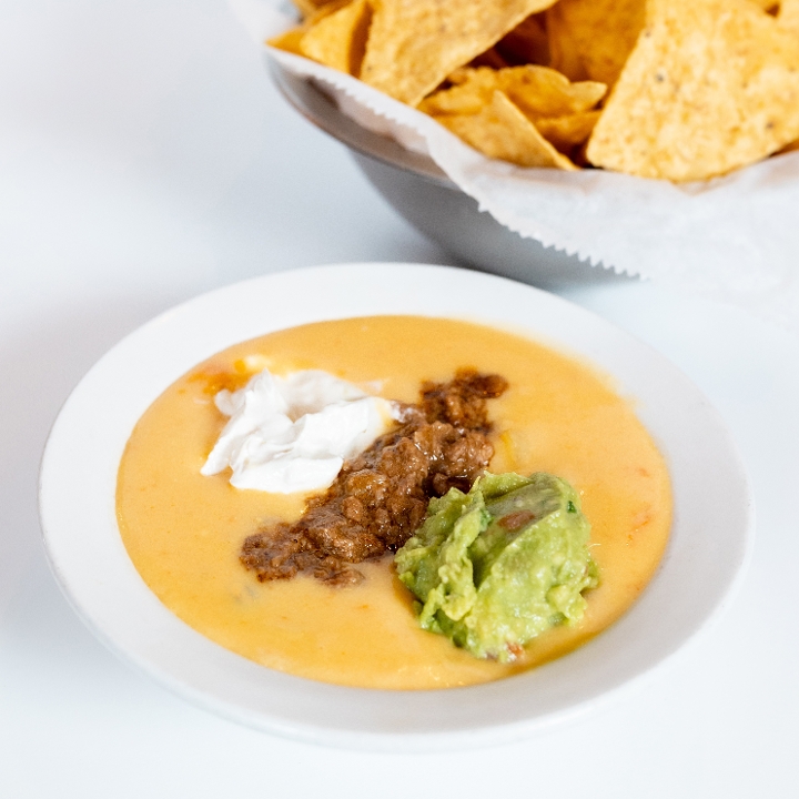 Order Chili con Queso Pint food online from El Fenix Mexican Restaurant store, Greenville on bringmethat.com