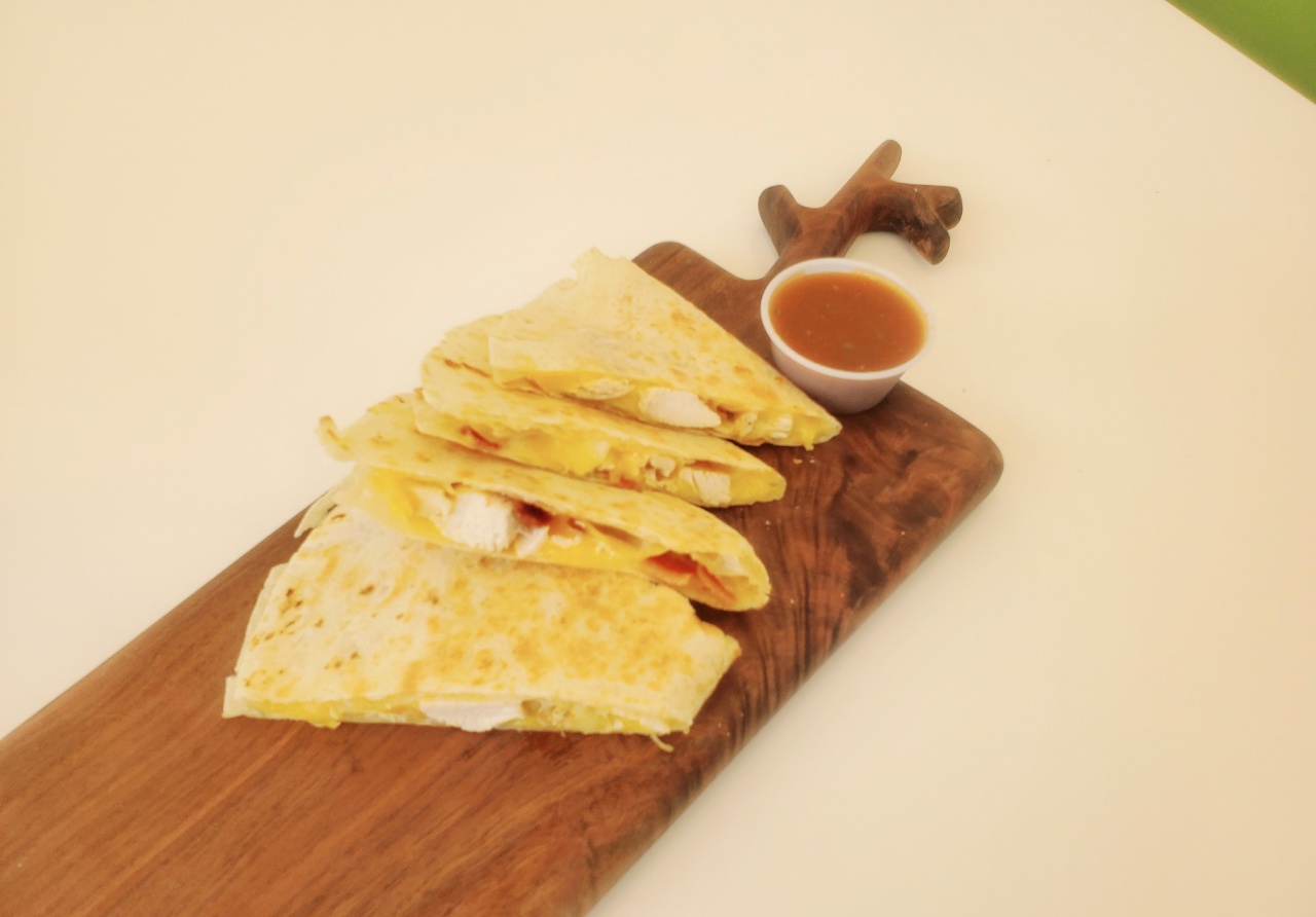 Order Chicken and Bacon Quesadilla food online from Cafe Artys II store, Newport Beach on bringmethat.com