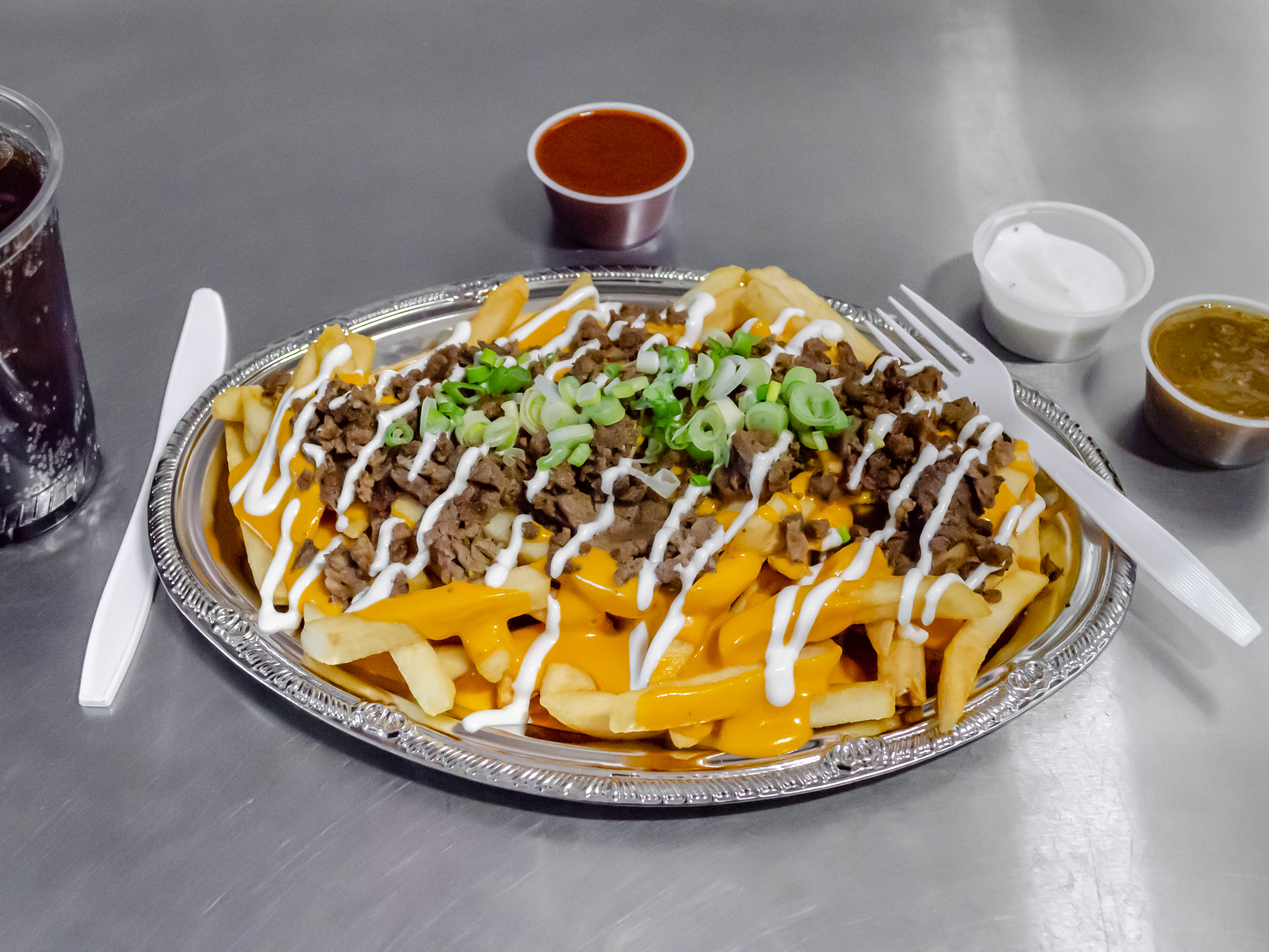 Order Loaded Fries food online from The Snow Cone Stop store, Sacramento on bringmethat.com