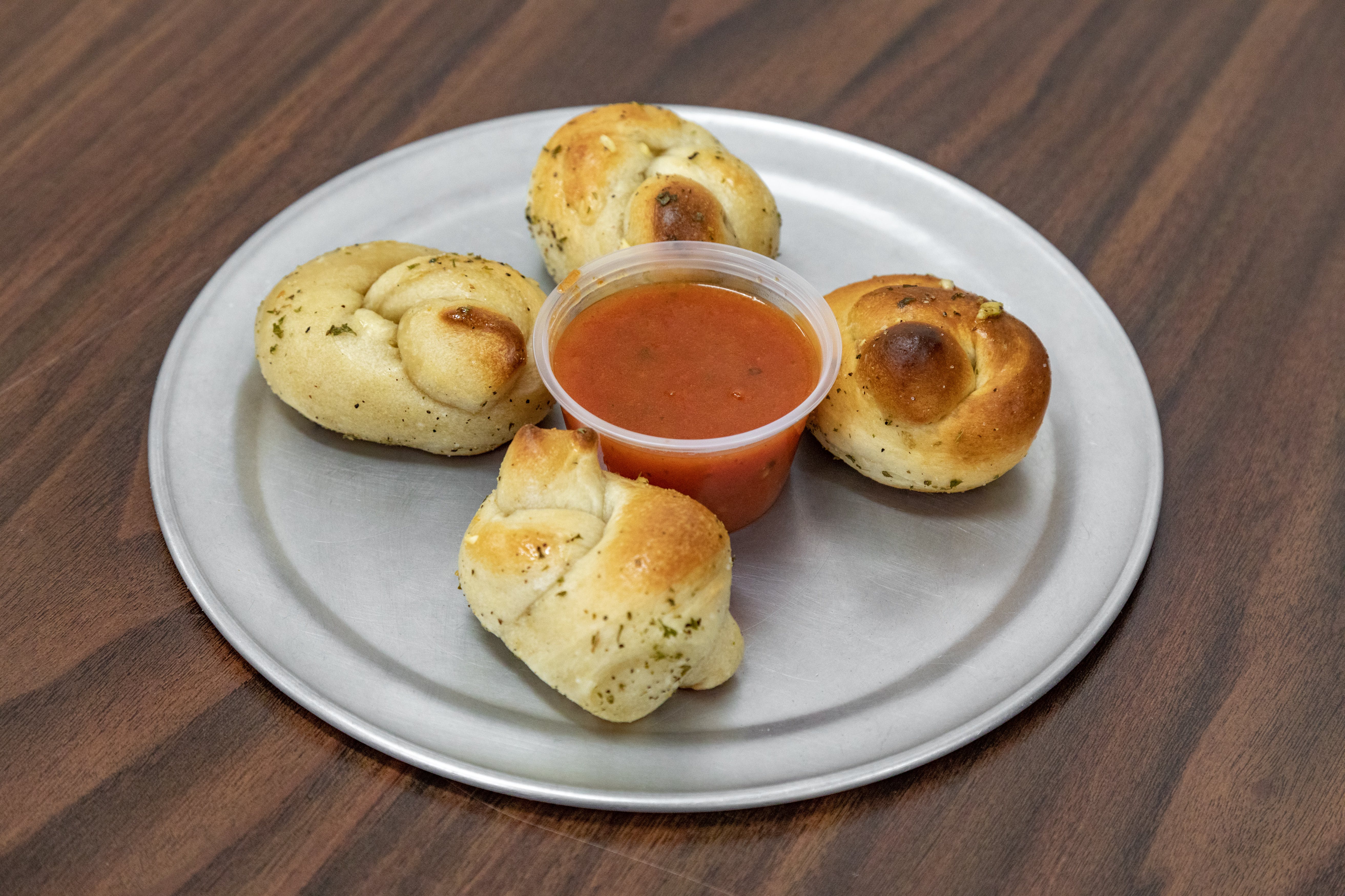 Order Garlic Knots - 4 Pieces food online from Pronta Pizzeria store, Indianapolis on bringmethat.com