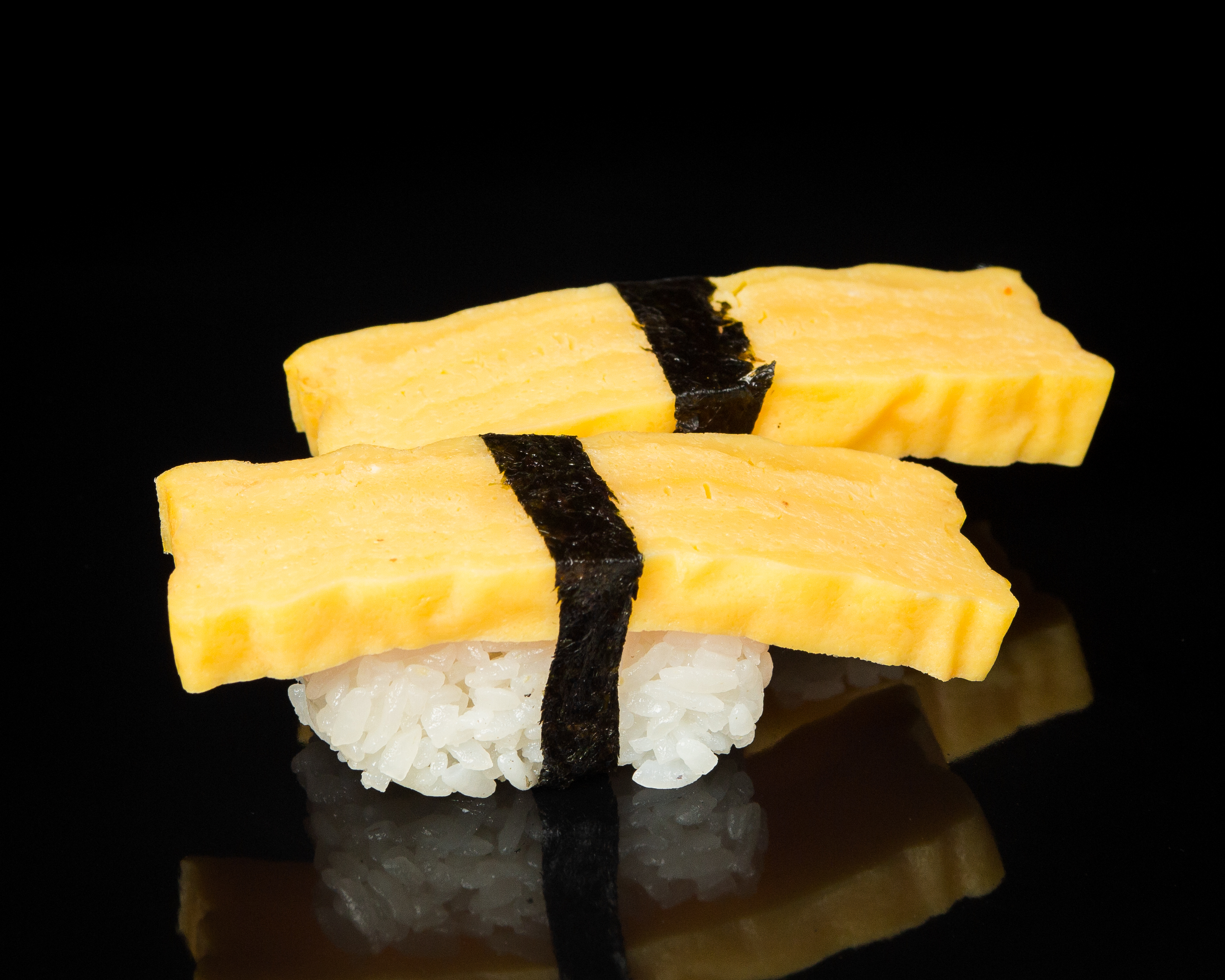 Order 2 Pieces Tamago food online from Sushi Sakura Express store, Houston on bringmethat.com