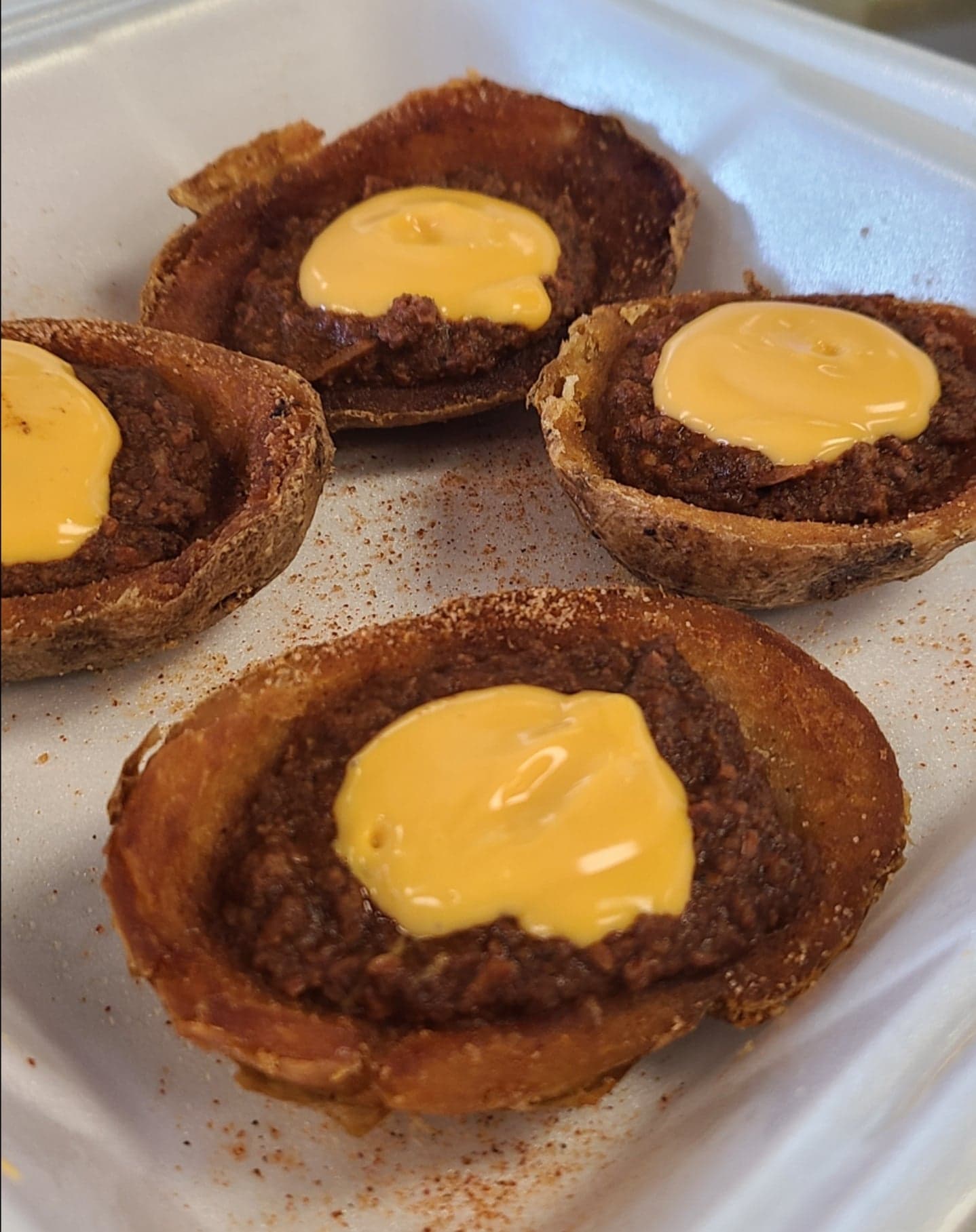 Order Chili Cheese Potato Skins food online from Doglicious Hot Dogs store, Glendale on bringmethat.com