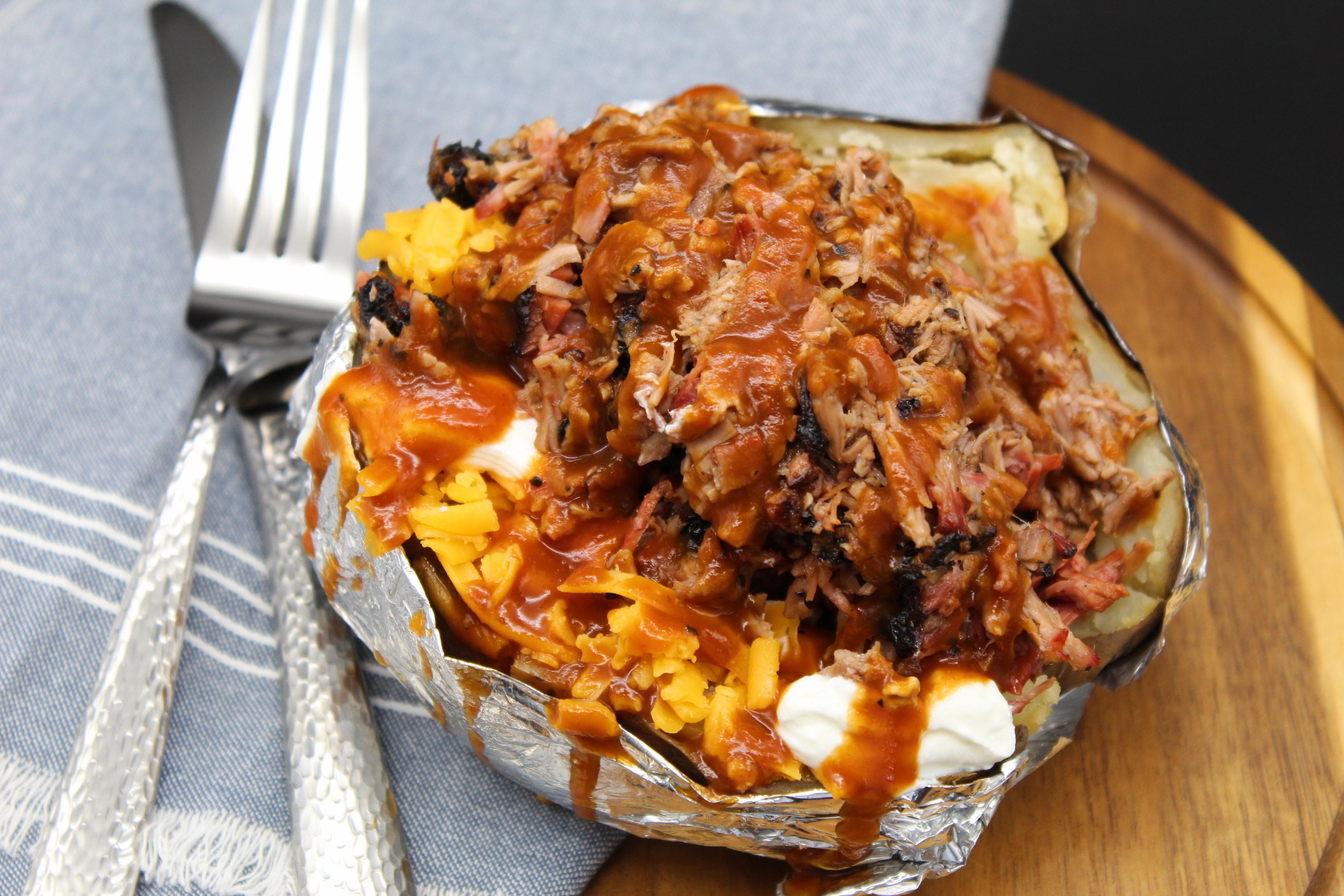Order Baked Potato with Meat food online from Mckenzie's Barbeque store, Conroe on bringmethat.com