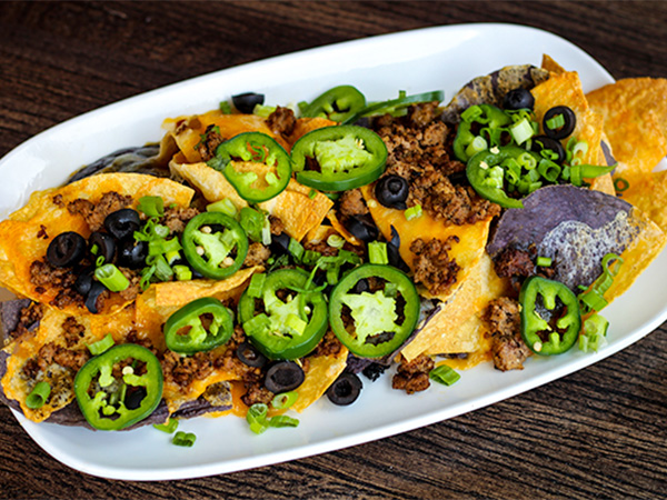 Order Nachos food online from Reds At Thousand Oaks store, Grand Rapids on bringmethat.com