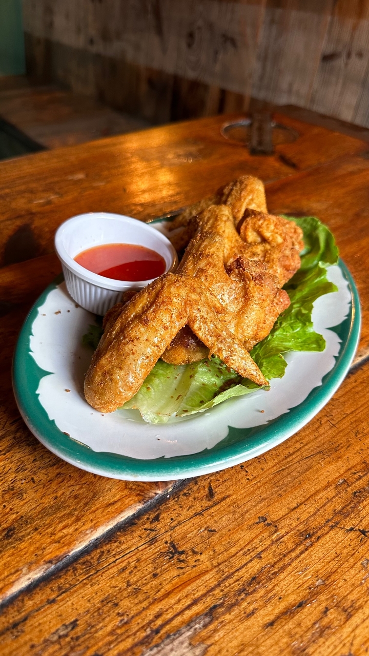 Order Dinosaur Wings food online from The Expat store, New York on bringmethat.com