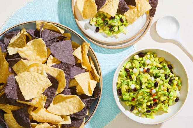 Order CATERING WHITE CORN GUACAMOLE + CHIPS food online from California Pizza Kitchen store, Lone Tree on bringmethat.com