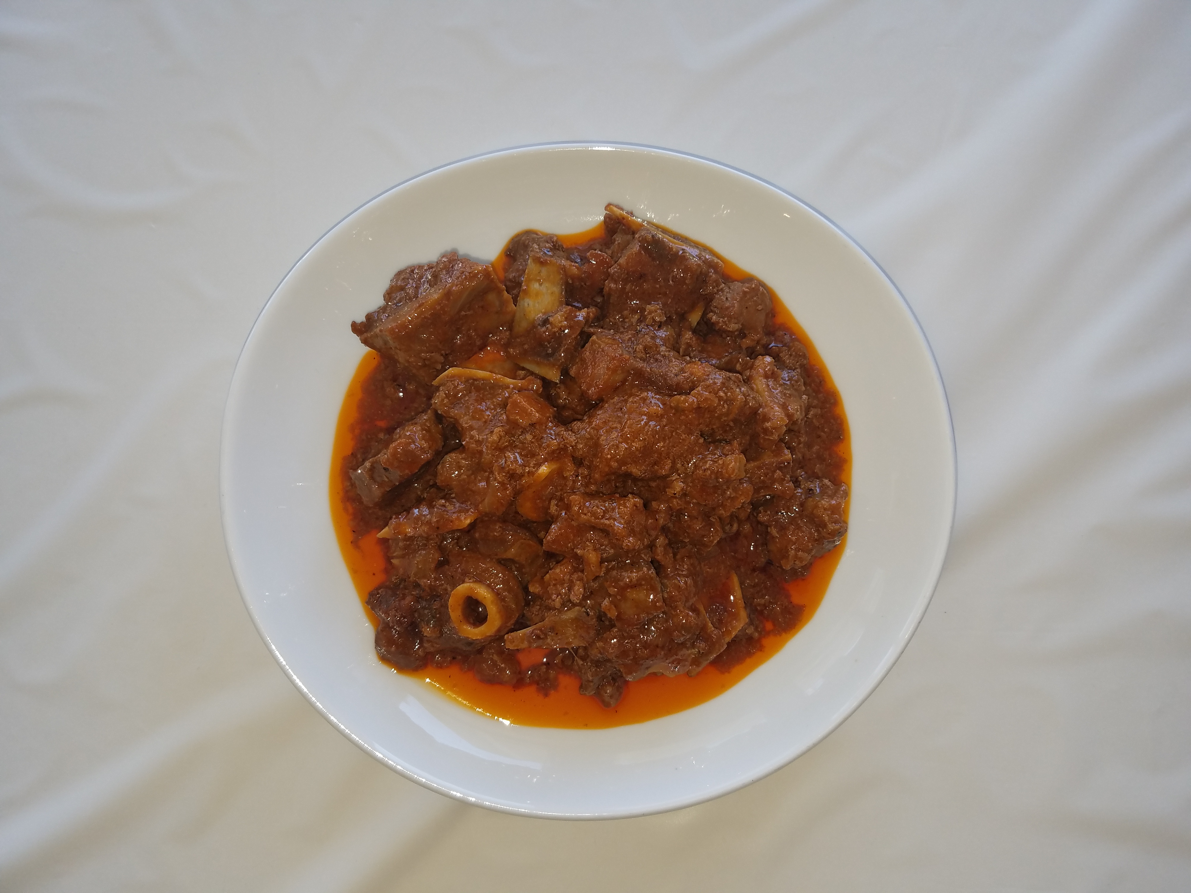 Order Mbuzi Mchuzi (Goat Stew) food online from Acacia Grill store, Worcester on bringmethat.com