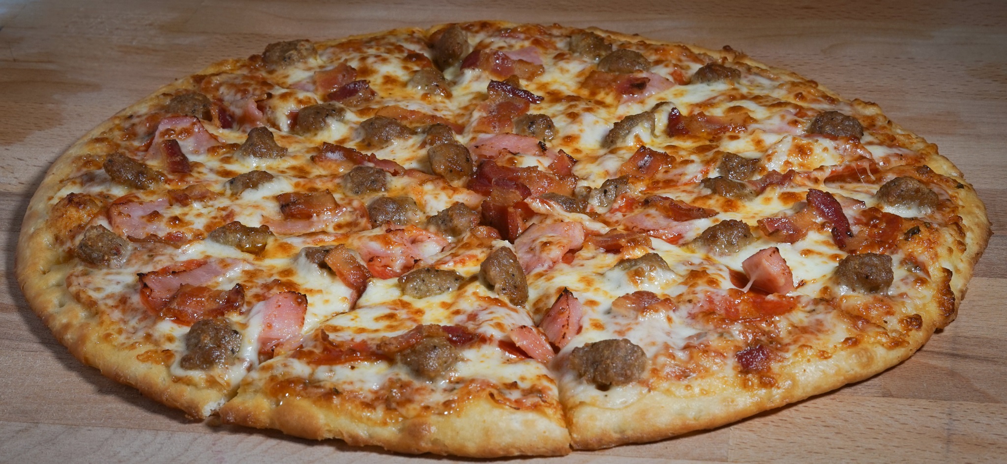 Order Meat Lovers Pizza food online from Wild Pepper Pizza store, Salt Lake City on bringmethat.com