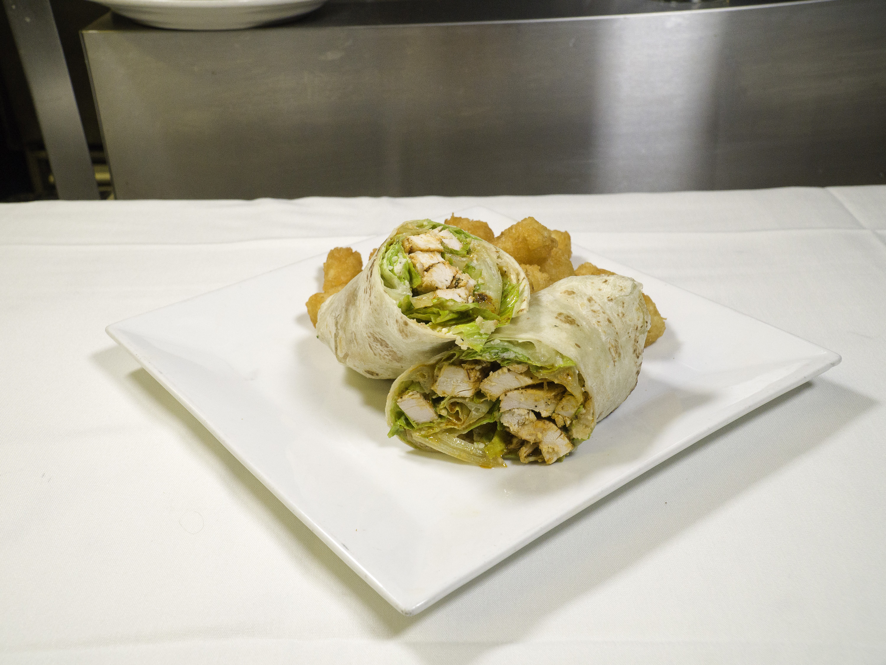 Order Chicken Caesar Wrap food online from The Bottom Line store, Toledo on bringmethat.com