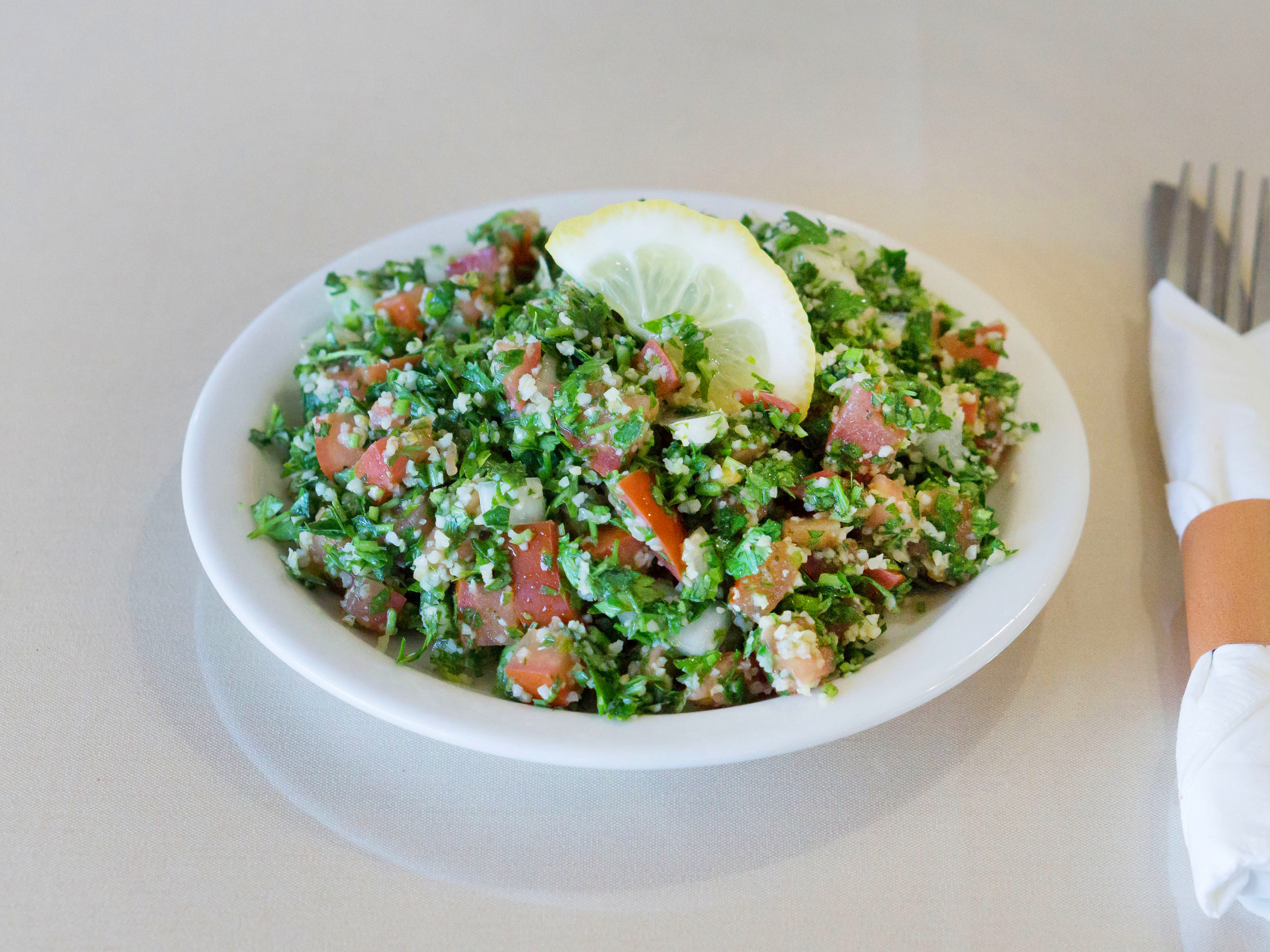 Order Tabouleh Salad food online from Mediterranean Restaurant store, Fresno on bringmethat.com