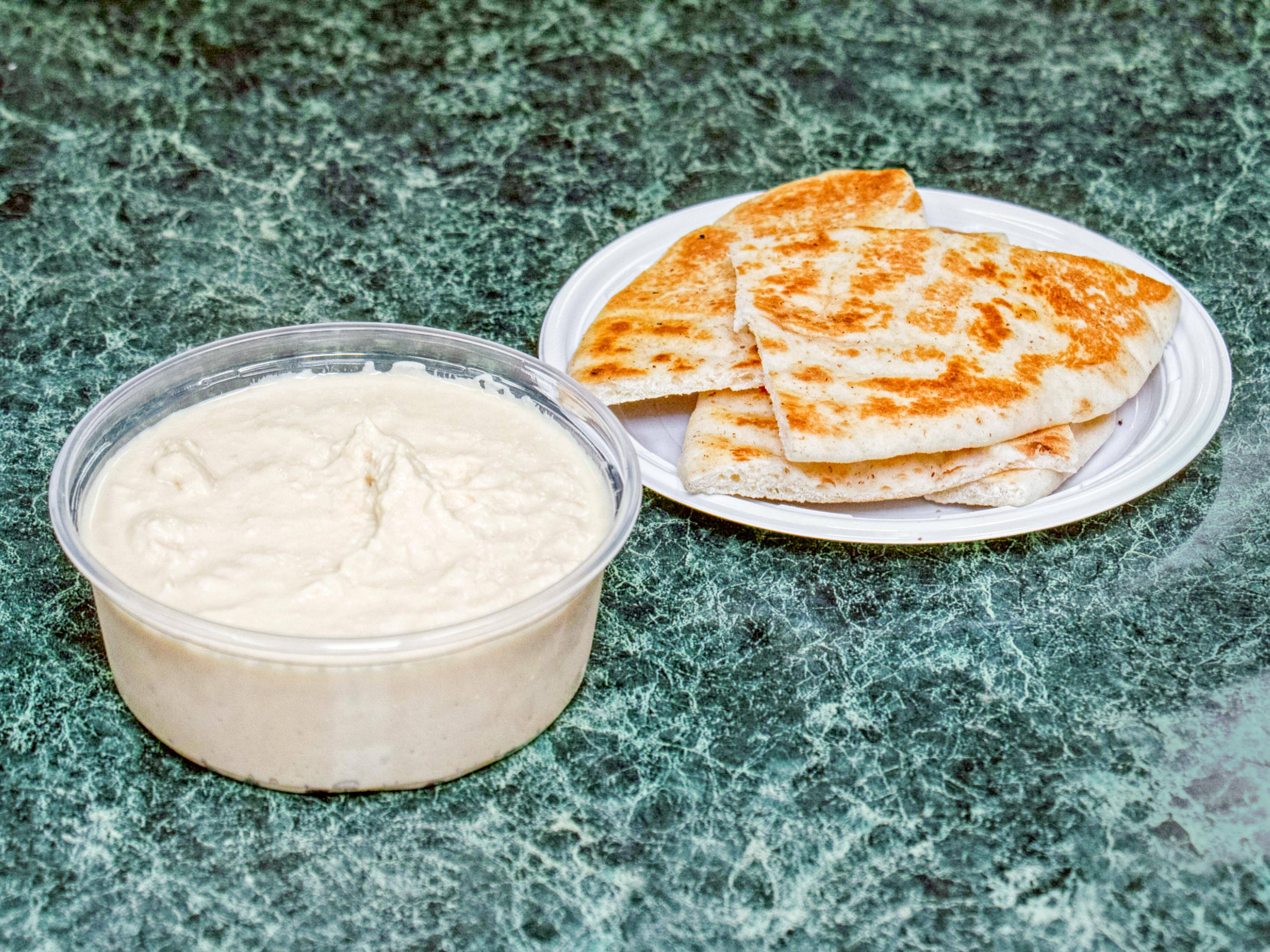 Order Hummus with Pita food online from Old Town Deli store, Alexandria on bringmethat.com