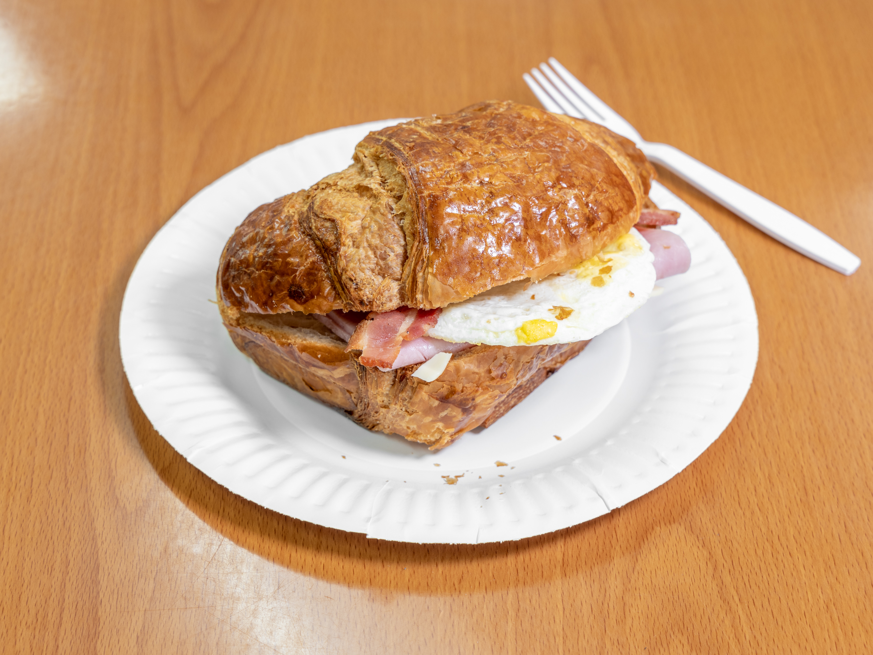 Order 8. Ham, Bacon, Egg & Cheese on Croissant food online from Love Donuts Cafe store, Riverside on bringmethat.com