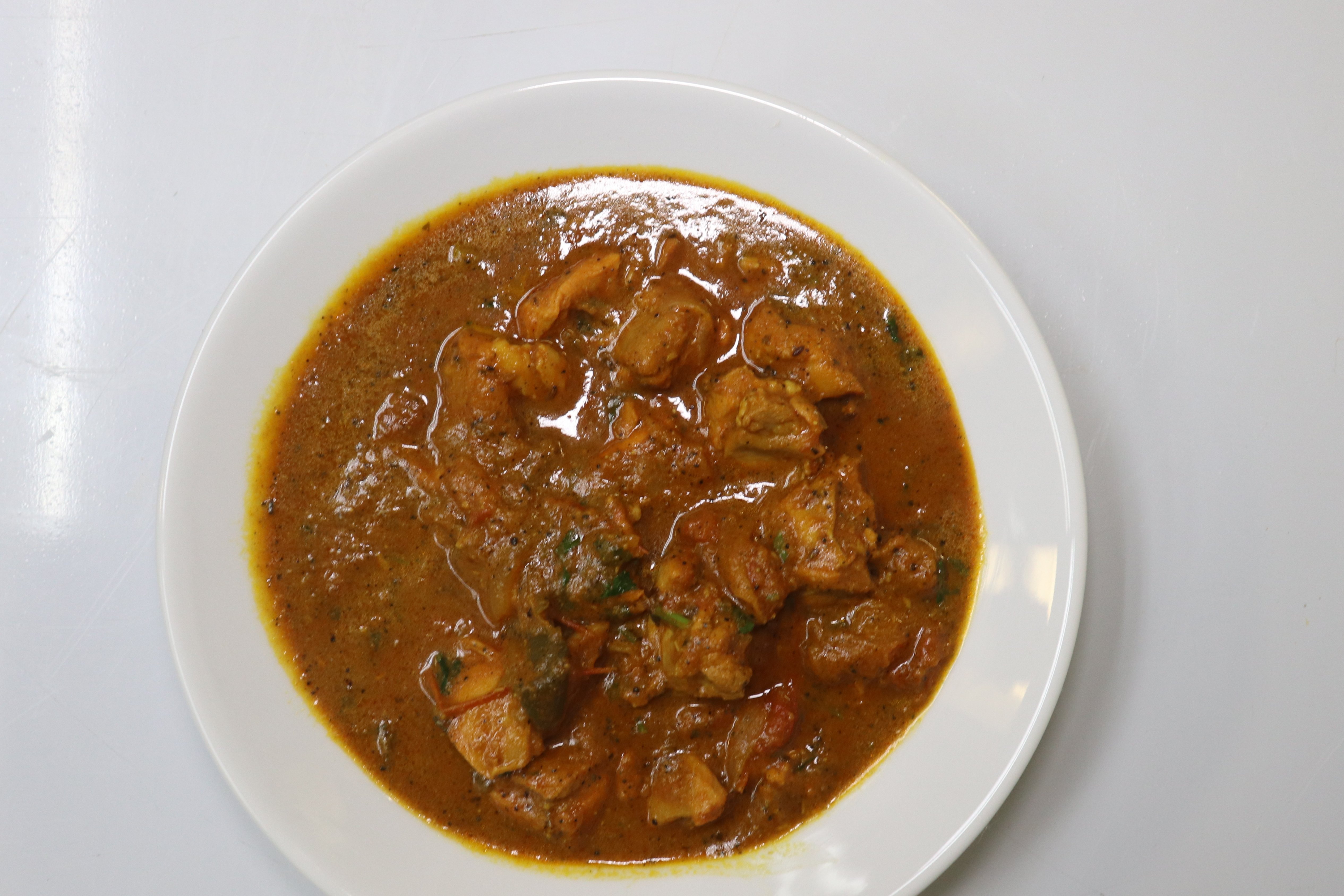 Order Chicken Curry food online from Hot N Spicy Restaurant store, Irving on bringmethat.com