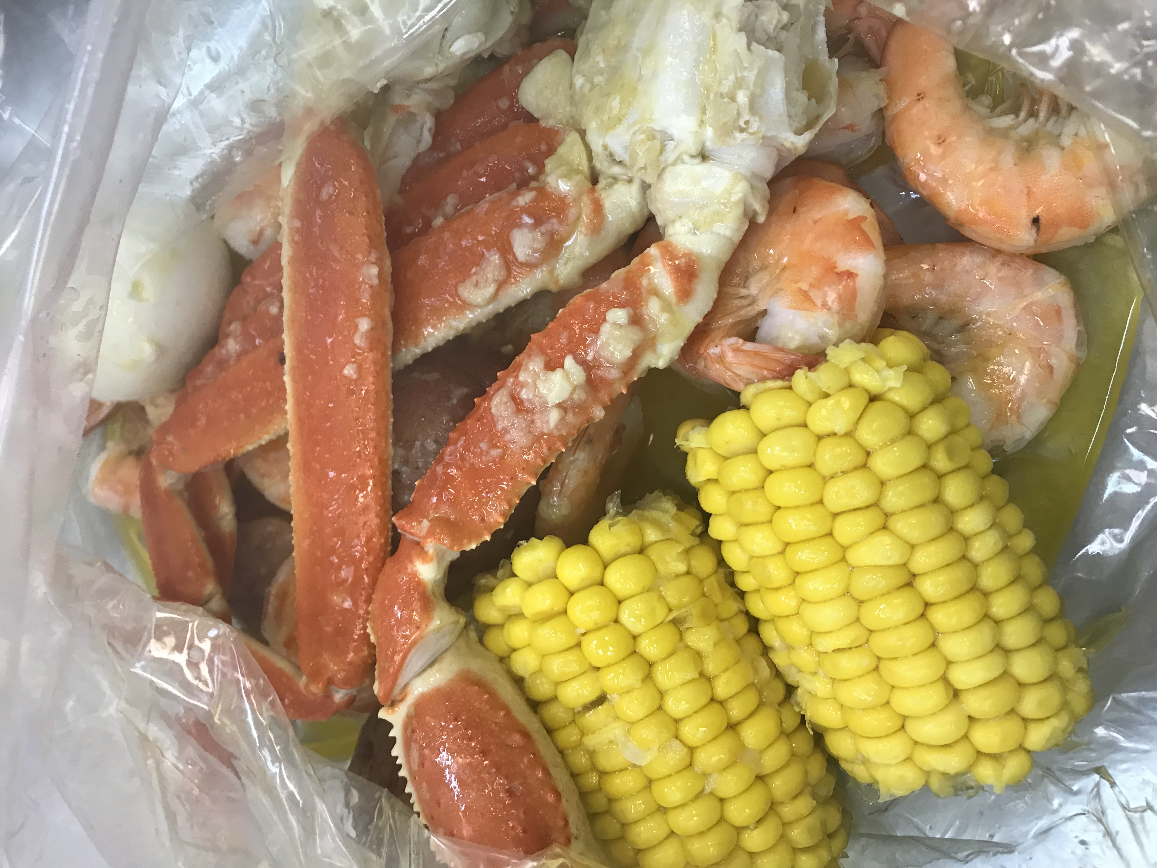 Order A. 1/2 lb. Snow Crab and 1/2 lb. Shrimp (No Head) Combo food online from Tasty Crab store, Fayetteville on bringmethat.com