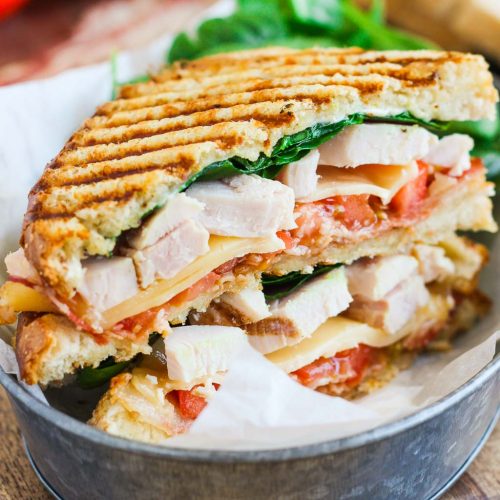 Order 6. Chicken Club Panini food online from Cafe Deli-Cious store, New York on bringmethat.com
