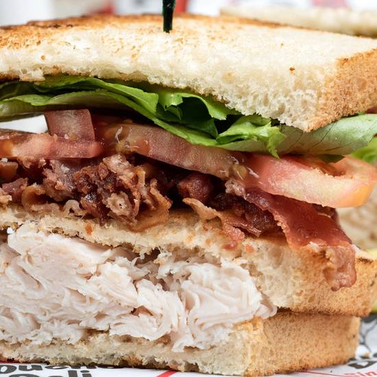 Order *Bacon & Turkey Club food online from Groucho's Deli store, Columbia on bringmethat.com