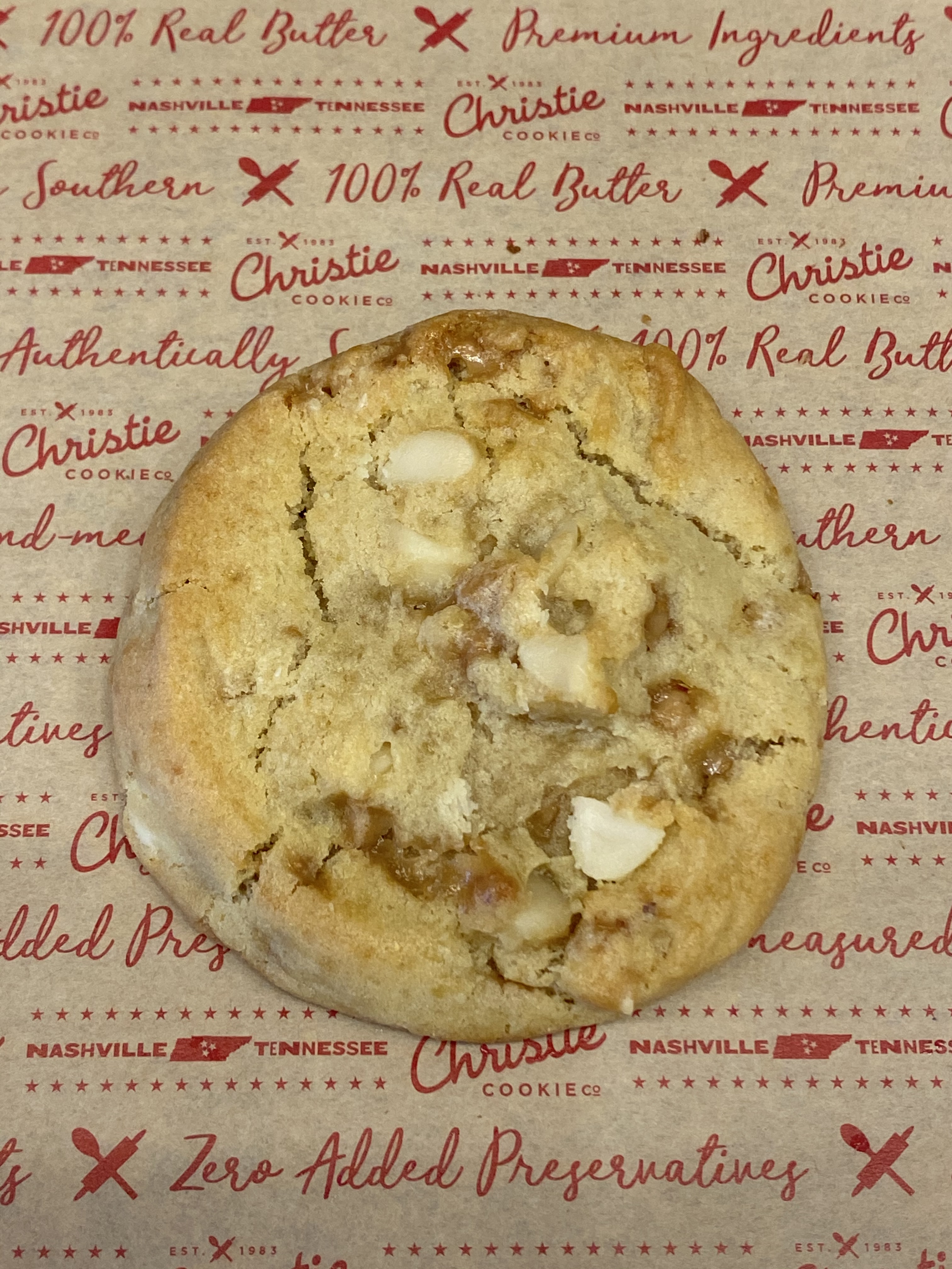 Order 1 White Chocolate Macadamia Nut Cookie food online from Christie Cookie Co store, Nashville on bringmethat.com