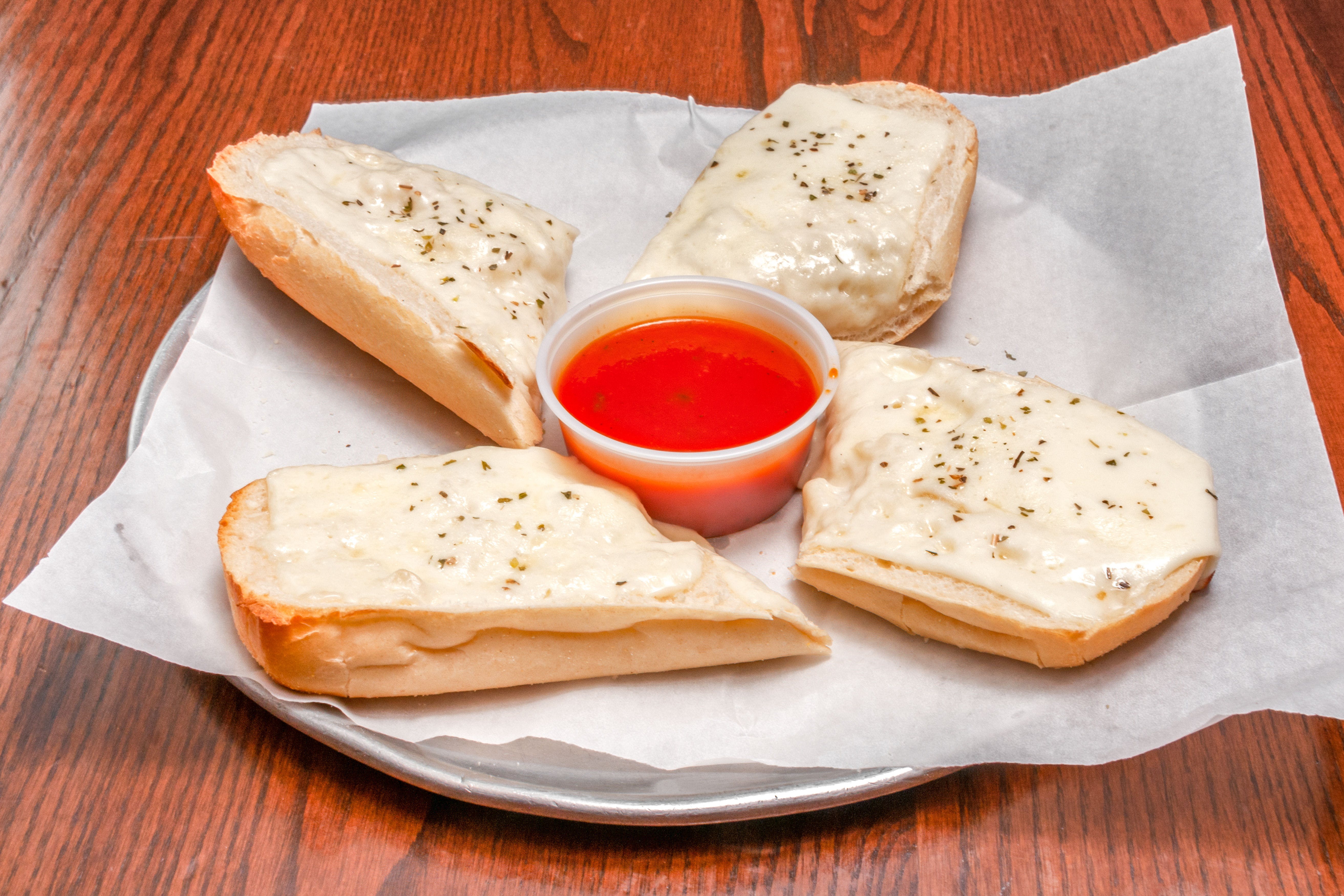 Order Cheesy Bread - 4 Pieces food online from Primo Pizza Ny Style store, Cary on bringmethat.com
