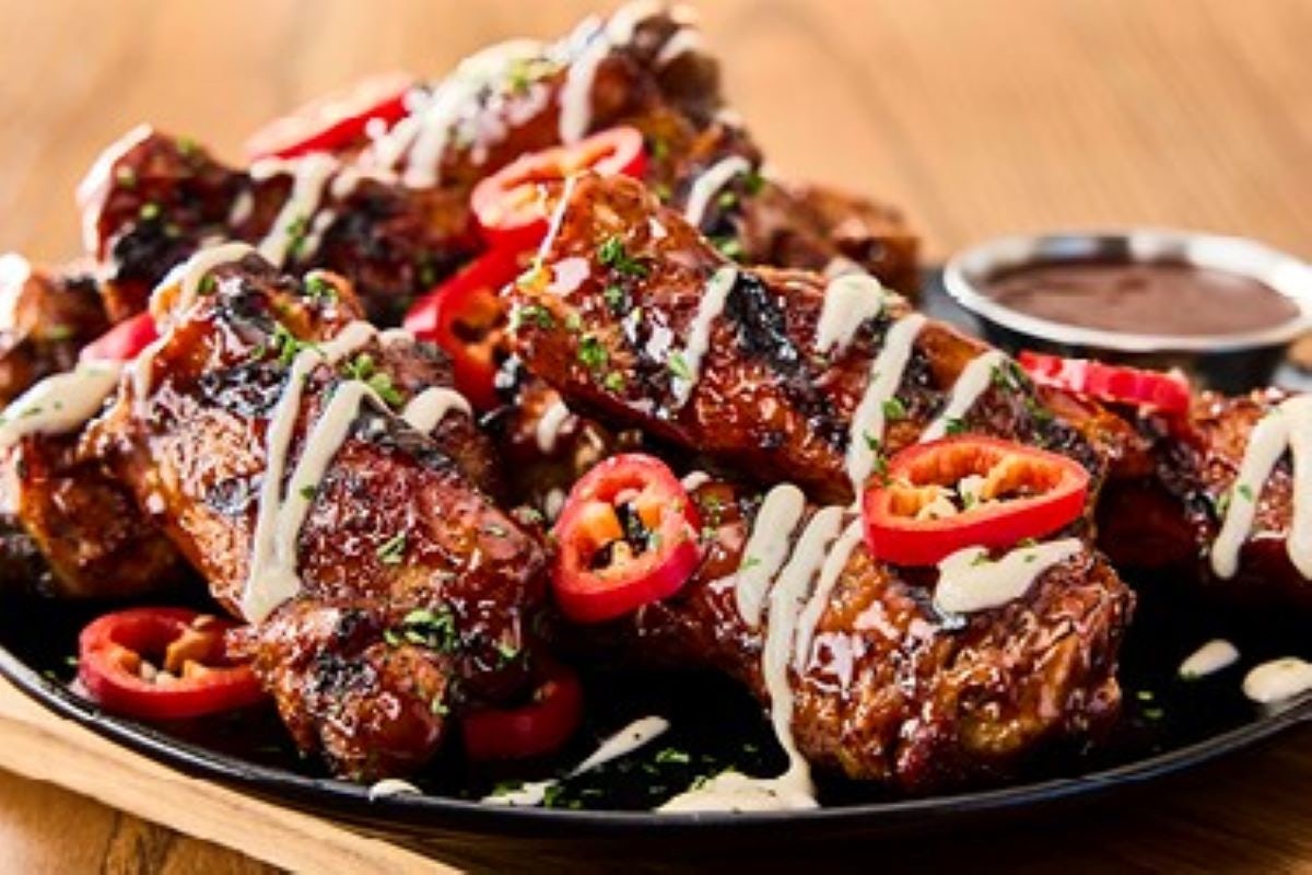 Order NEW! Aussie Chook Ribs* food online from Outback Steakhouse store, Silver Spring on bringmethat.com