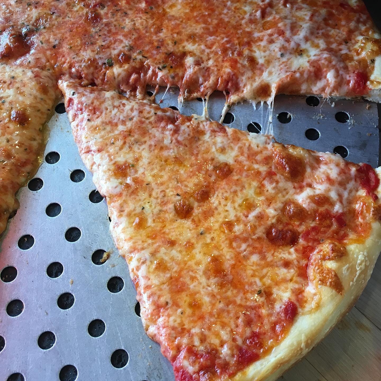 Order Cheese Pizza Slice - Slice food online from Pizza Garden store, Flushing on bringmethat.com