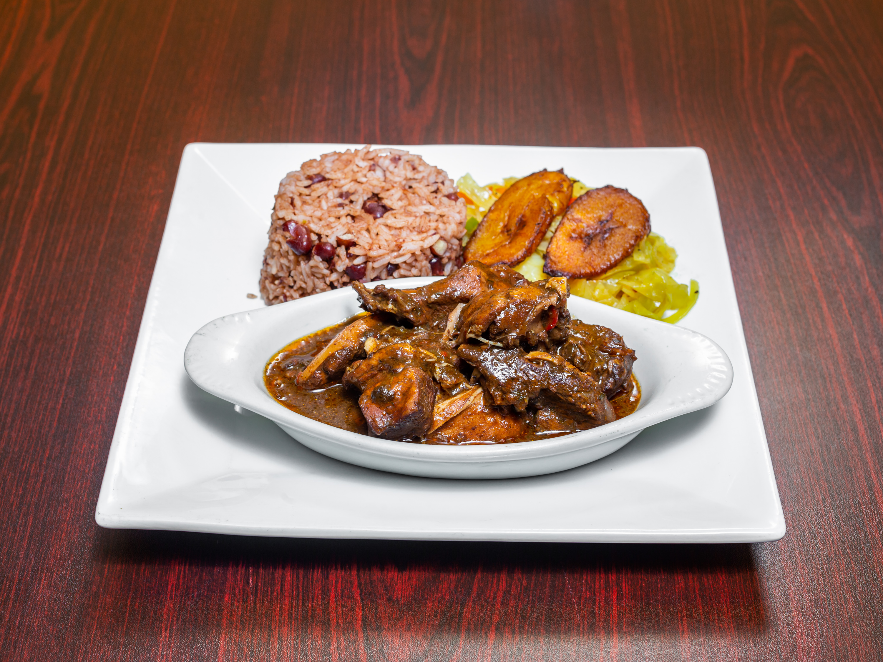 Order Country Style Brown Stew chicken food online from Malakhi Lounge & Jamaican Restaurant store, Manassas on bringmethat.com